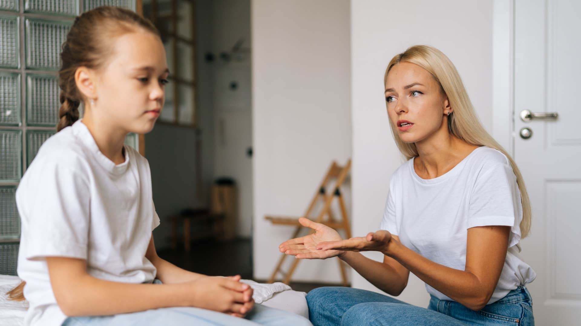 little girl avoiding eye contact with mother