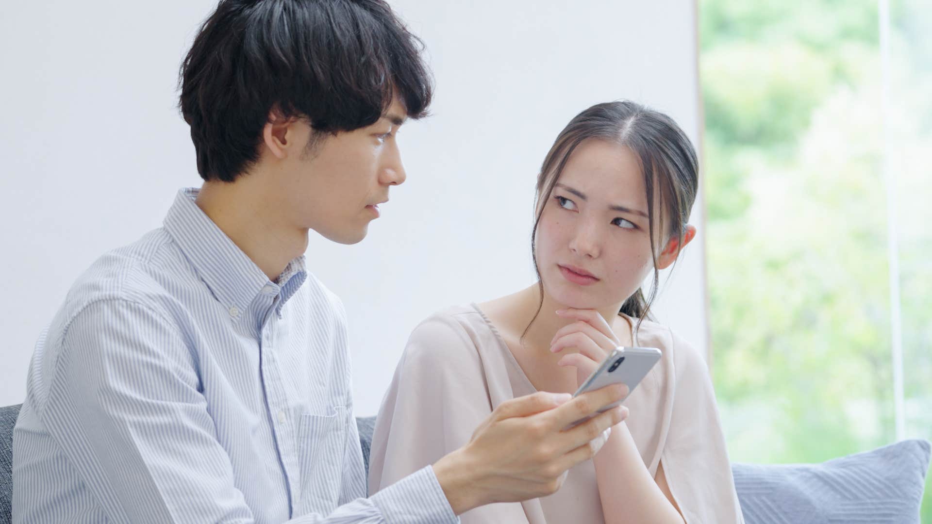 distrusting woman looking at man