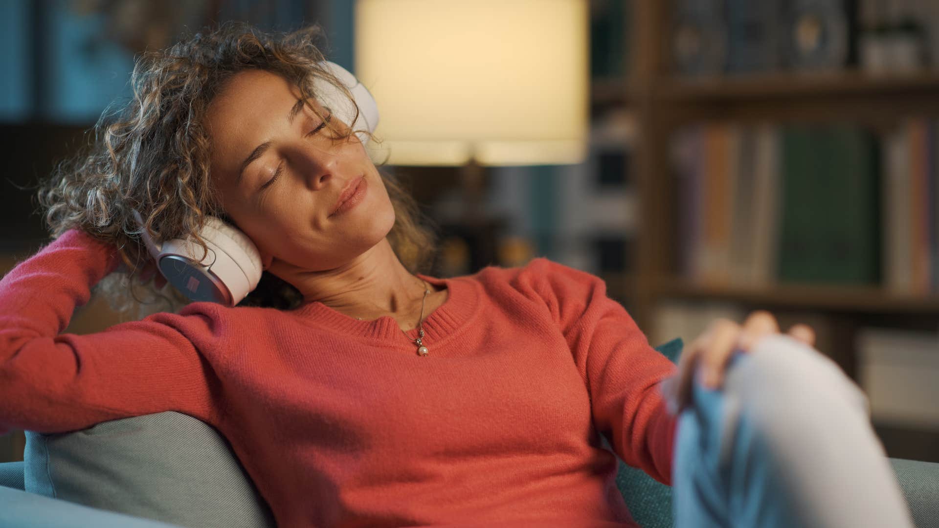 happy woman listening to music away from people