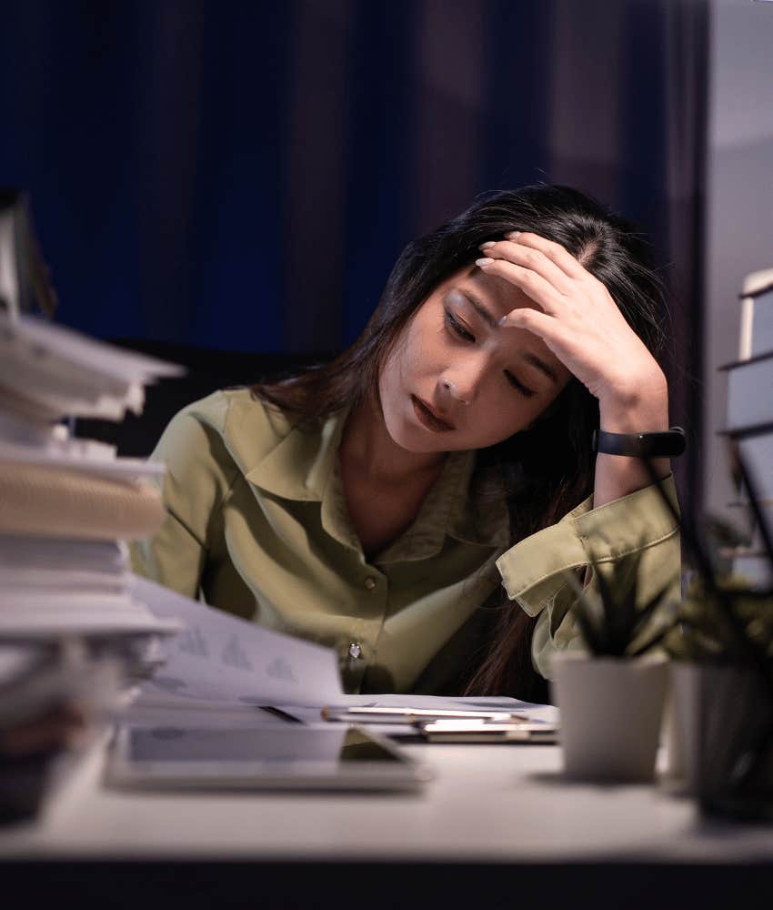 overworked woman tasked with work outside the scope of her job