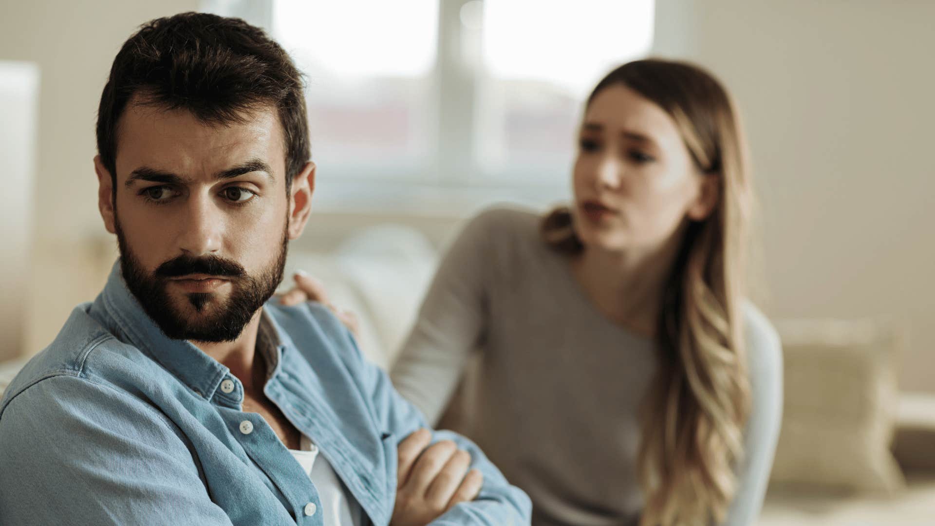 husband distances himself emotionally as his wife tries to talk to him