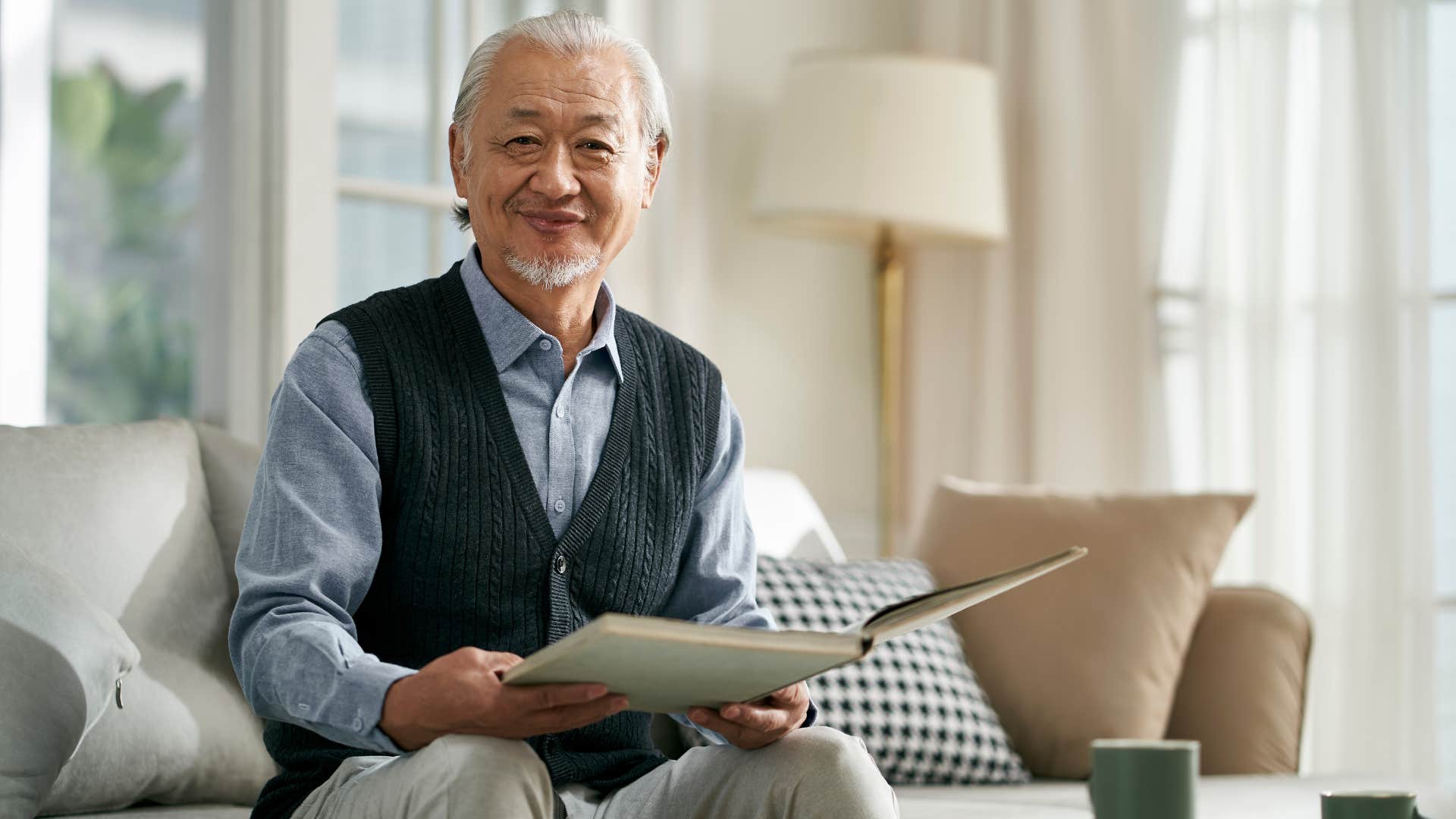 man smiling with notebook in hand ready for what is next