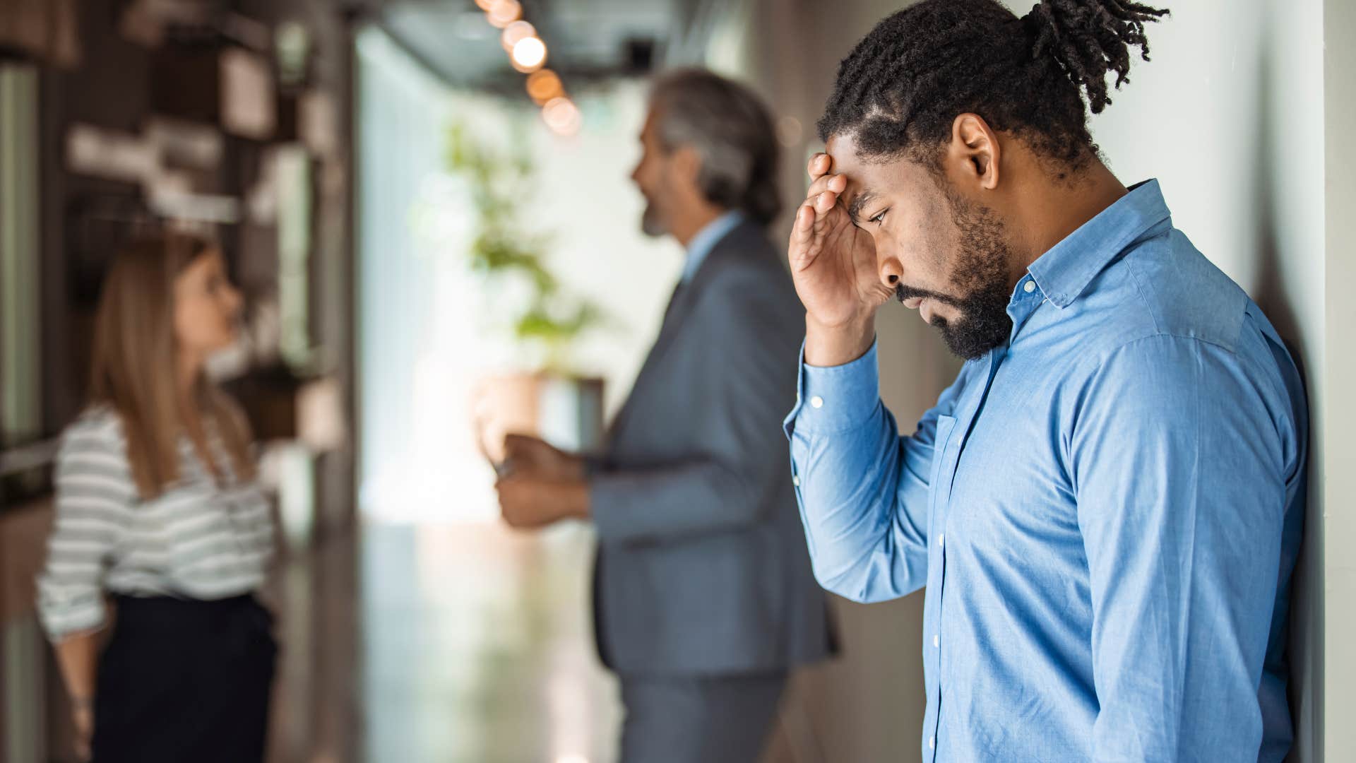 frustrated employee receiving bad news at work