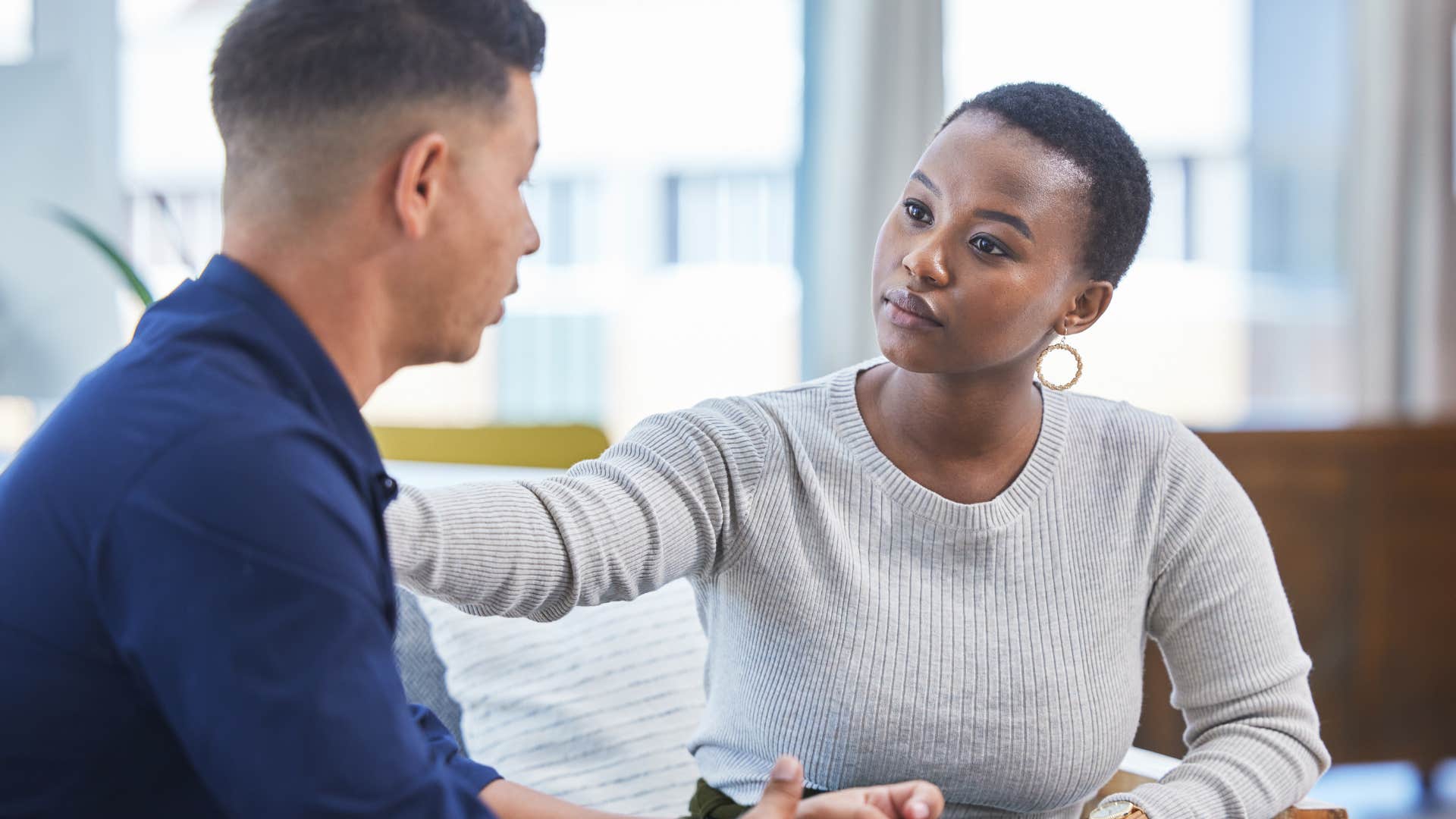 employee correcting colleague on role at work