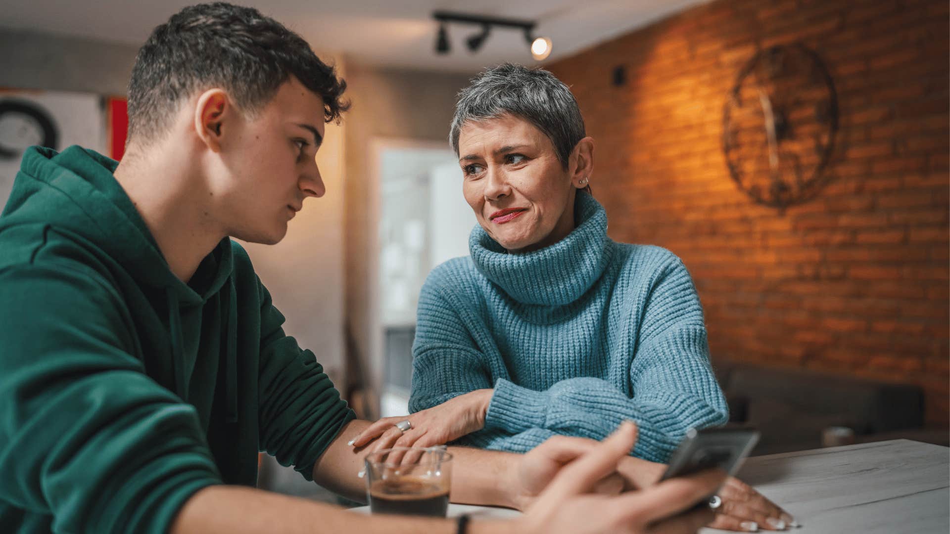 woman whose emotionally constipated son gets visibly awkward when people show emotions
