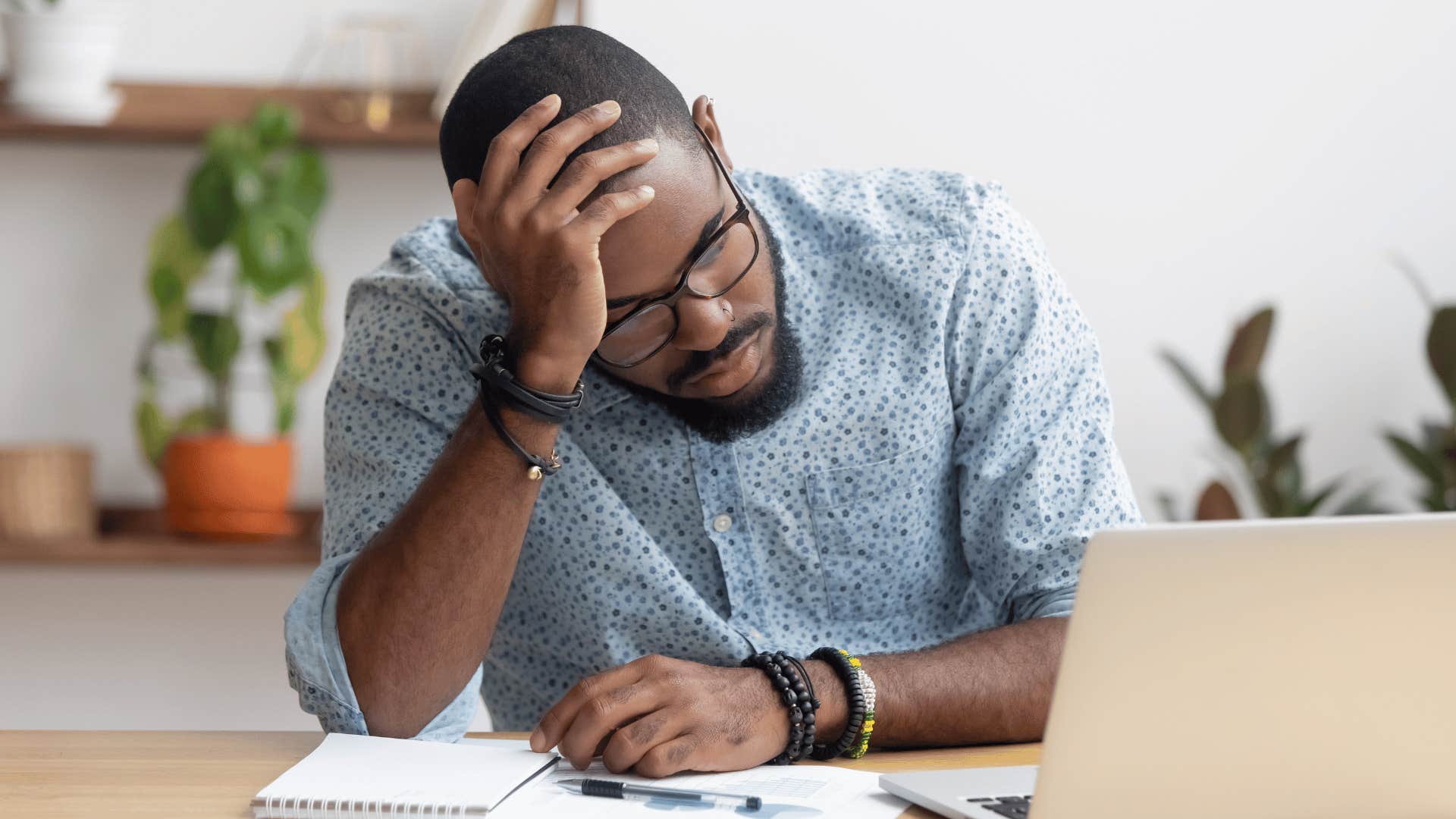 stressed man feels burned out at work