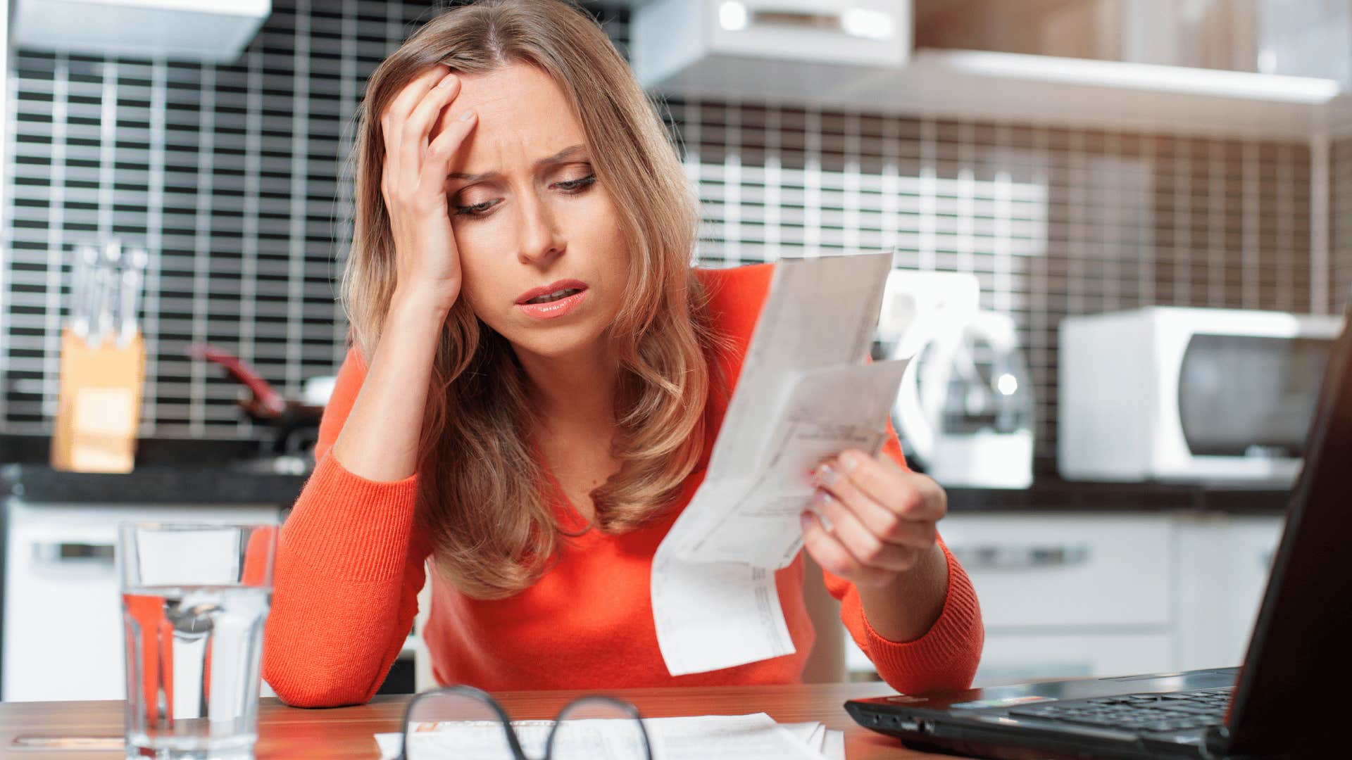 Woman feeling stressed about her finances