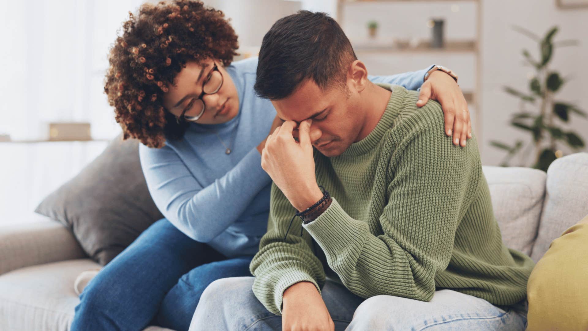 woman picks up on a man's struggles and tries to comfort him
