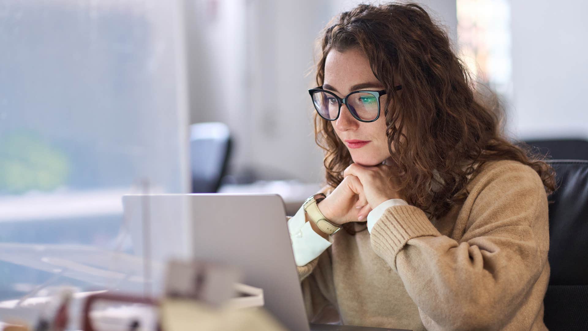 woman hesitating to respond to email