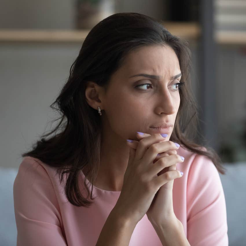 deeply unhappy woman sitting