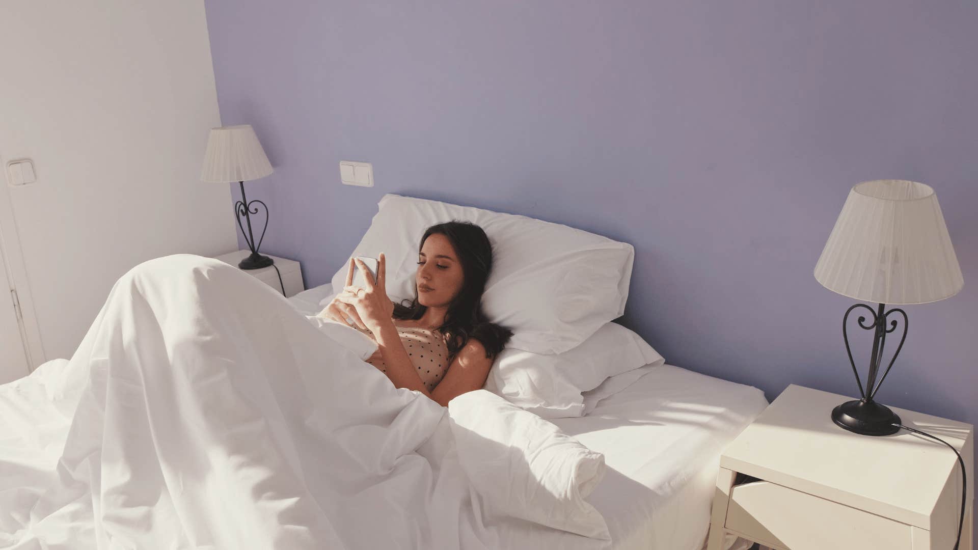 woman who got back in bed because she got on her phone