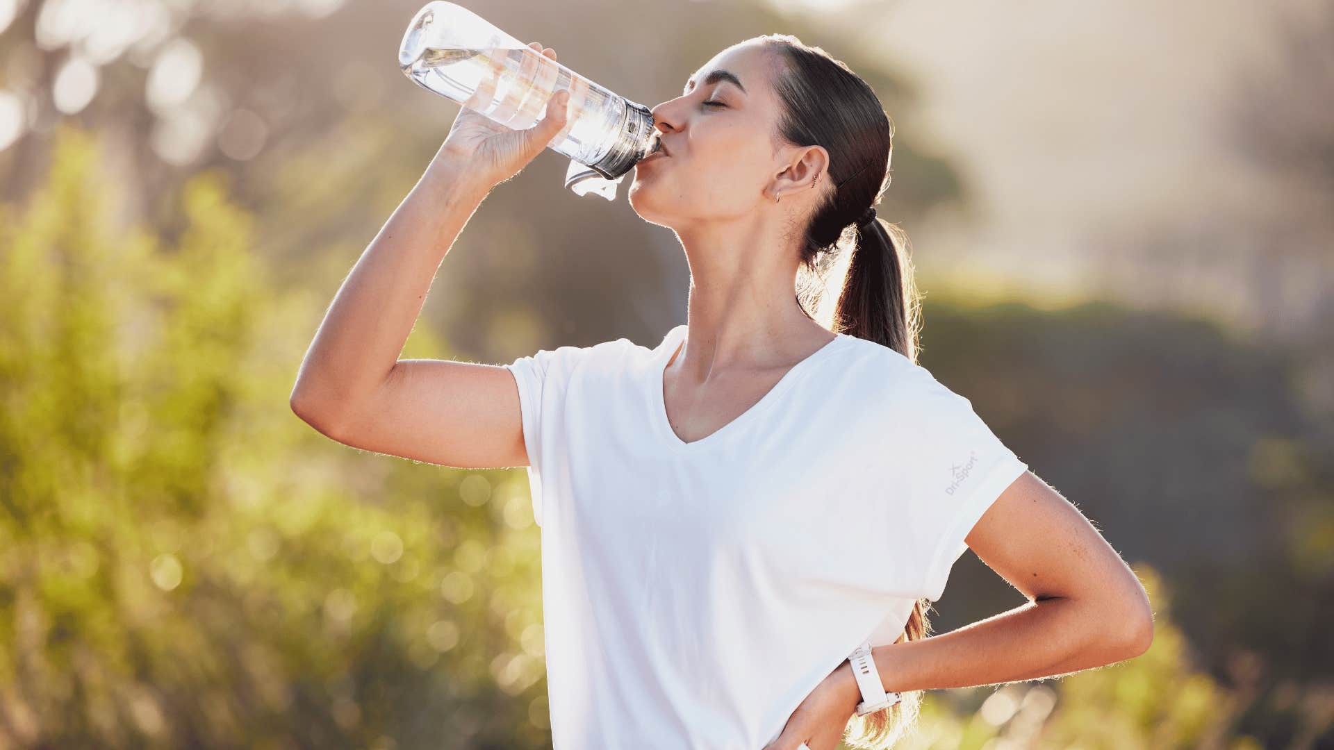 woman hydrating so she won't want to get back in bed and hide