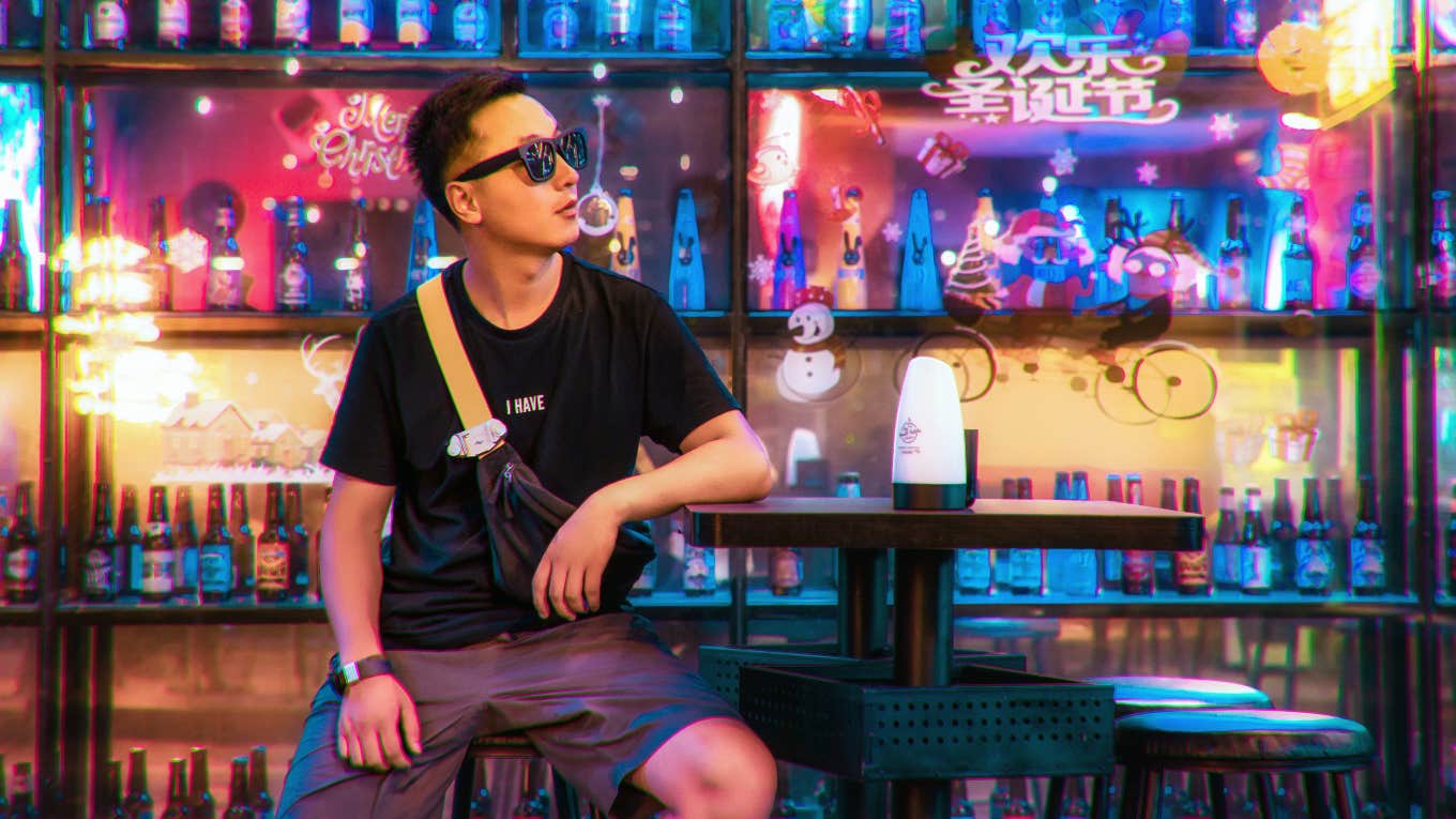 Man at a Japanese bar that uses wristbands to let customers know if you want to talk