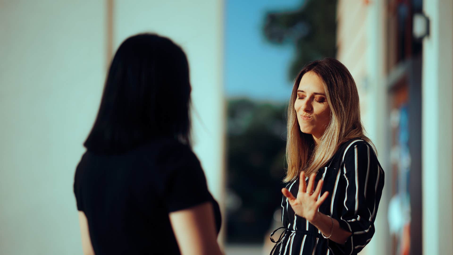 woman blaming someone who is not good for her for her bad behavior
