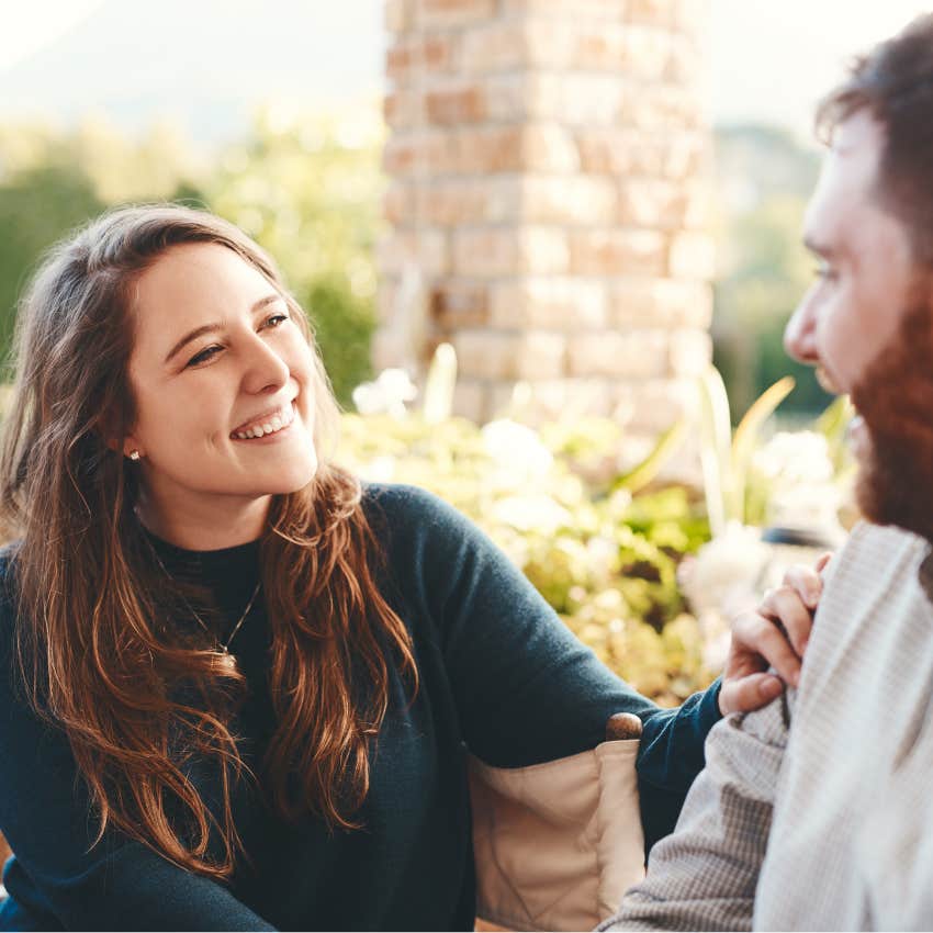 man who wants to date woman exclusively whispering special words to her