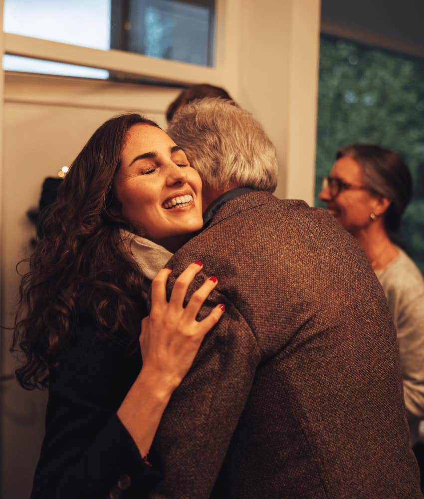 Woman hugs man's parent after introduction plus hug