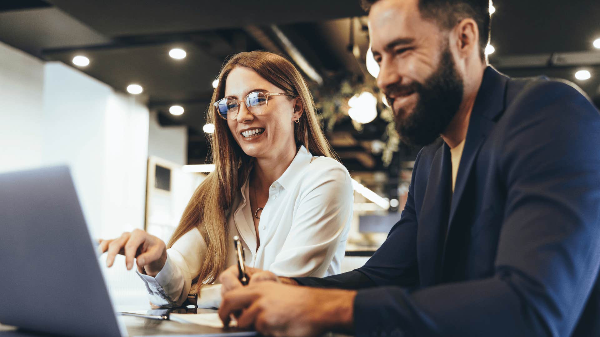 woman smiling next to man everyone respects
