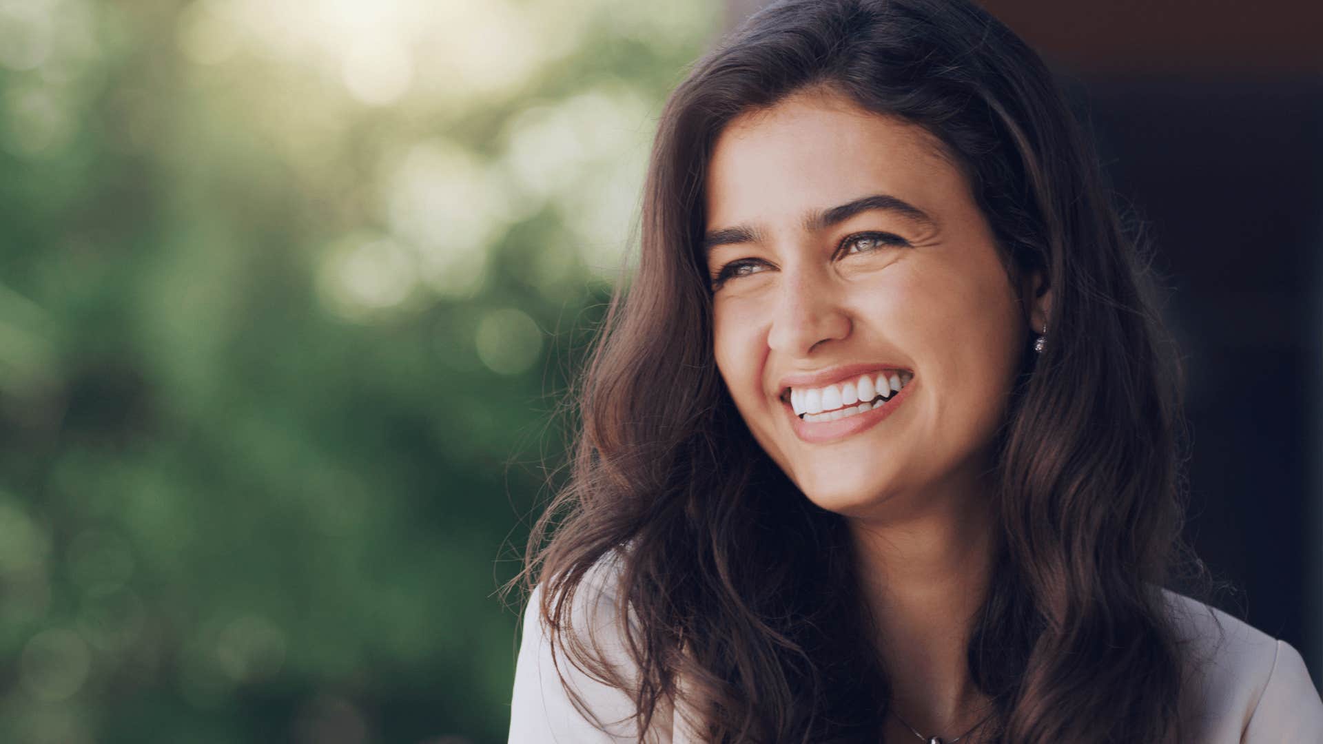 smiling woman who everyone respects outside