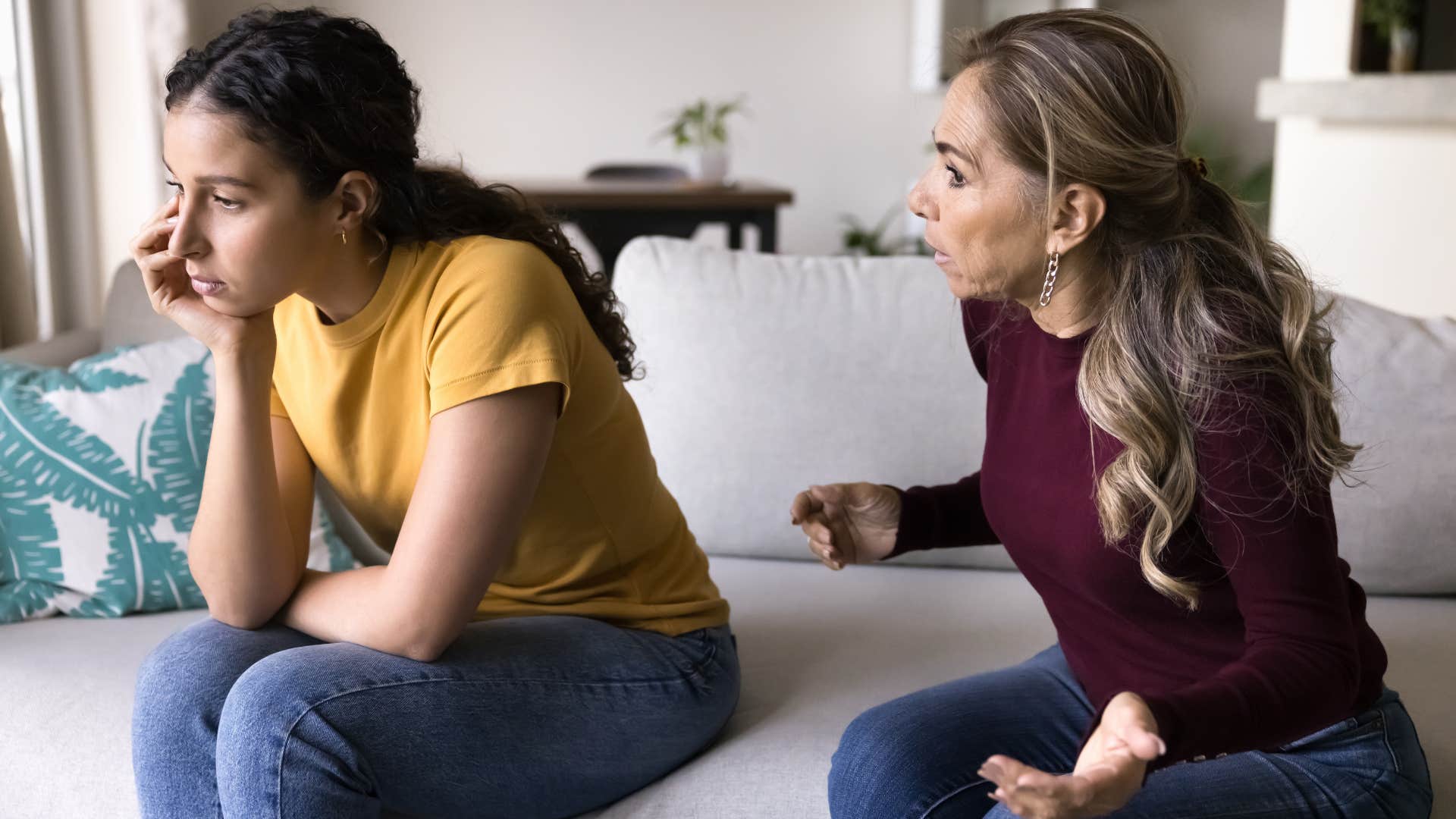 mother telling daughter that's just the way she is as daughter in yellow shirt turns away from her