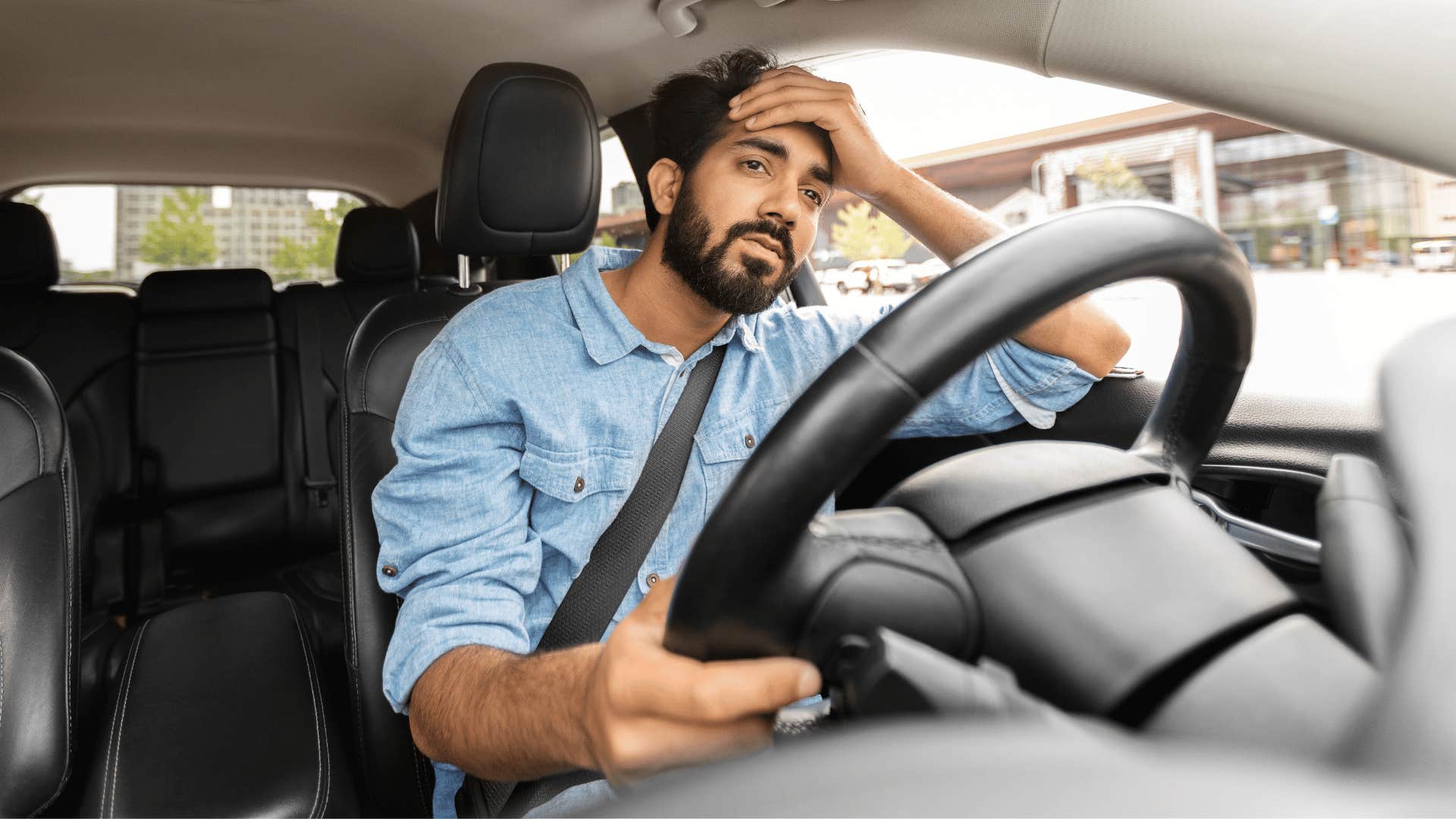 man driving car not letting people merge