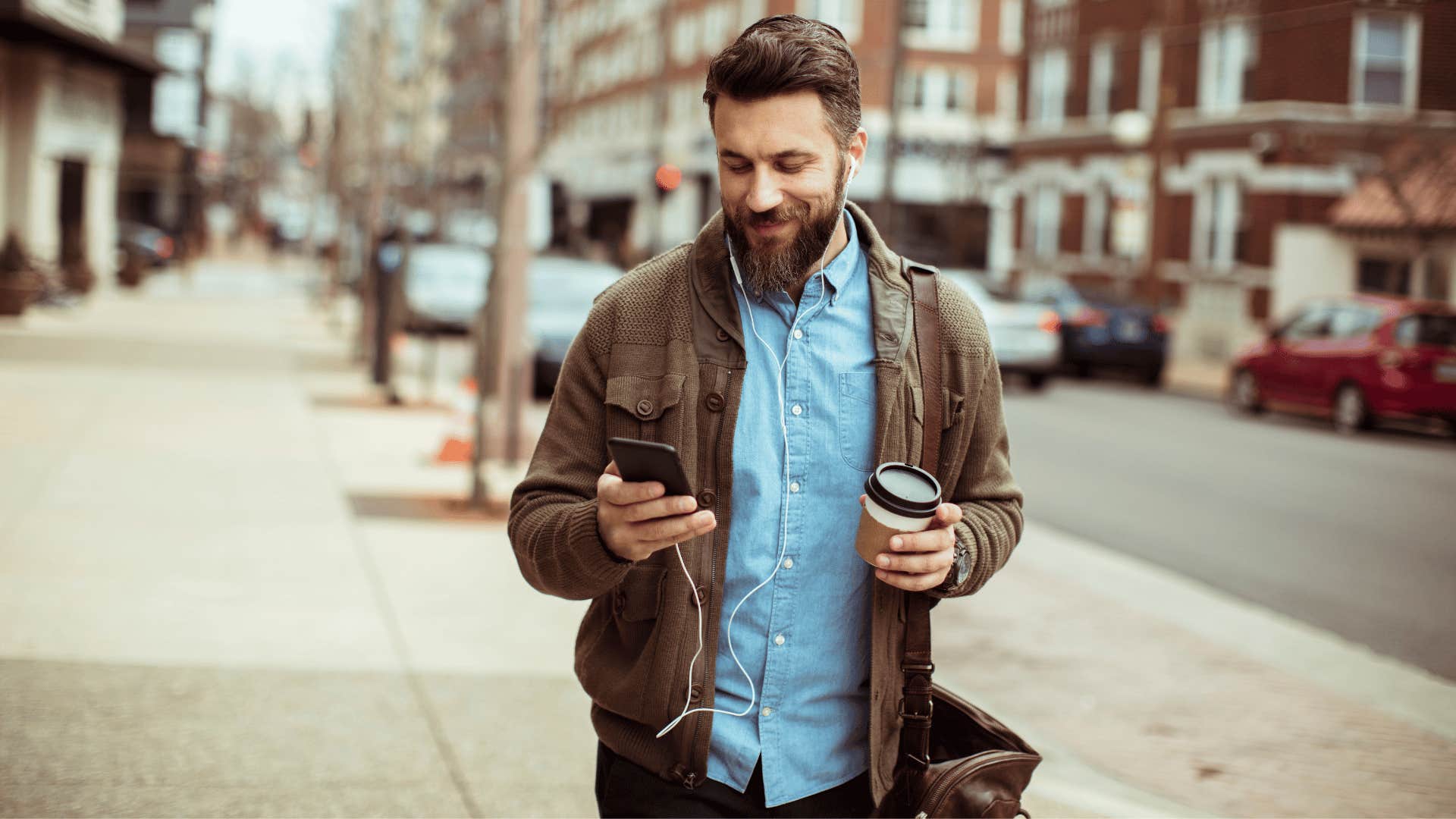 man walking slow while on phone