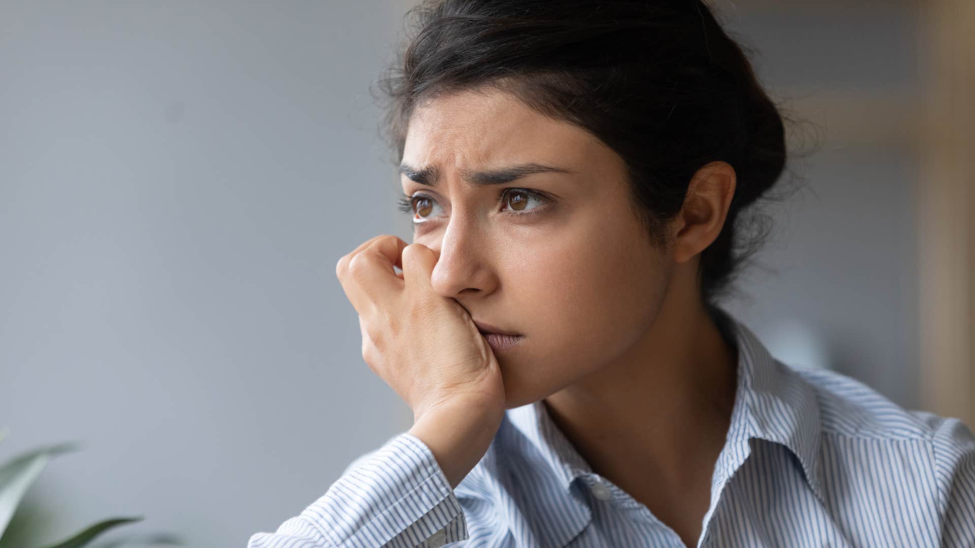sad woman trying to hide her loneliness