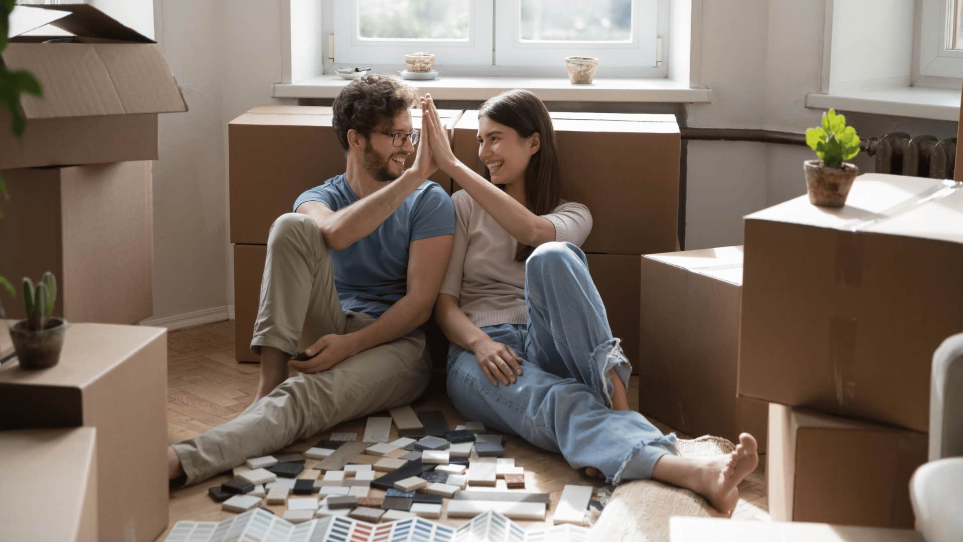 couple unpacking in new apartment