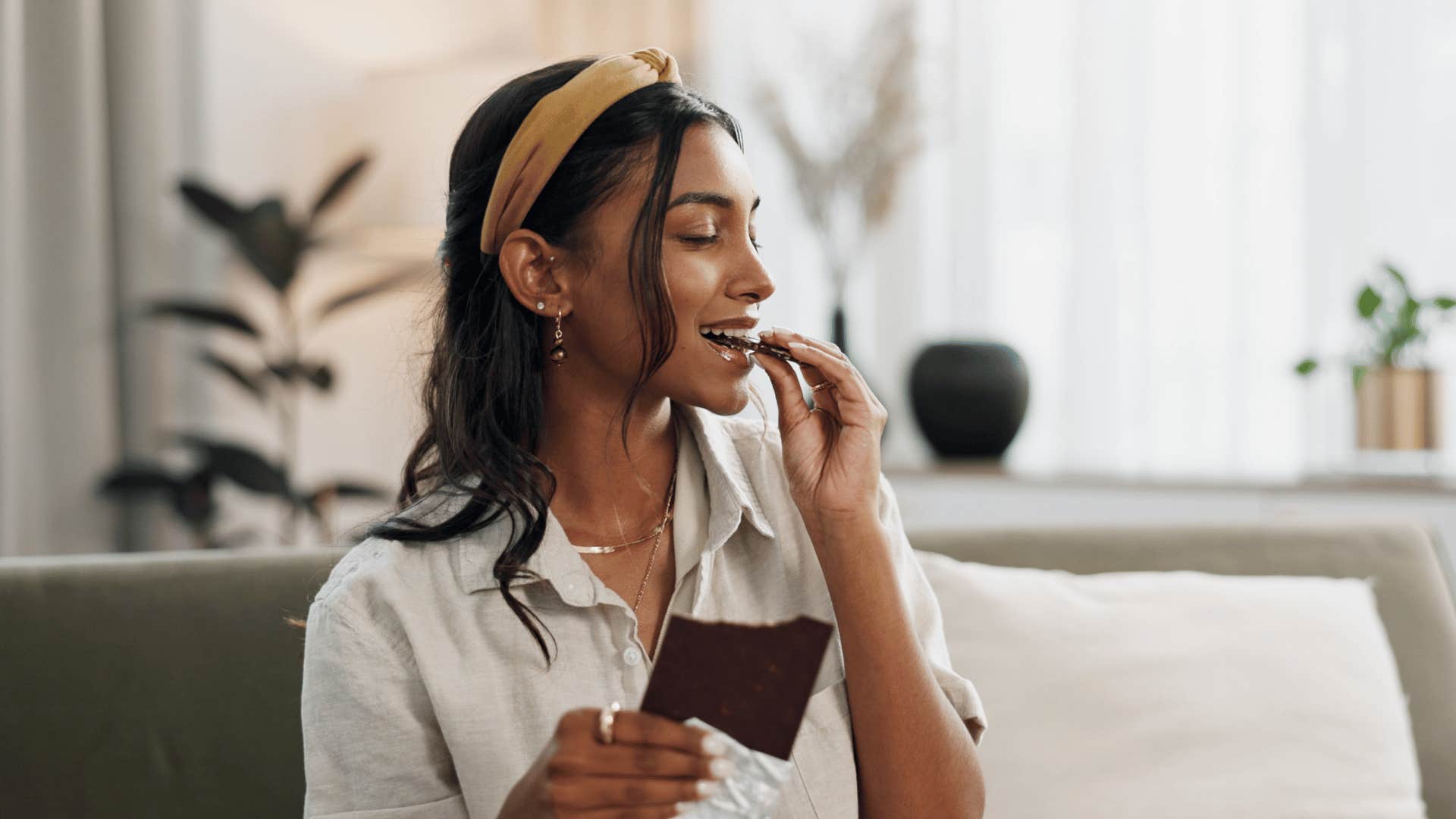 millennial woman treating herself to chocolate