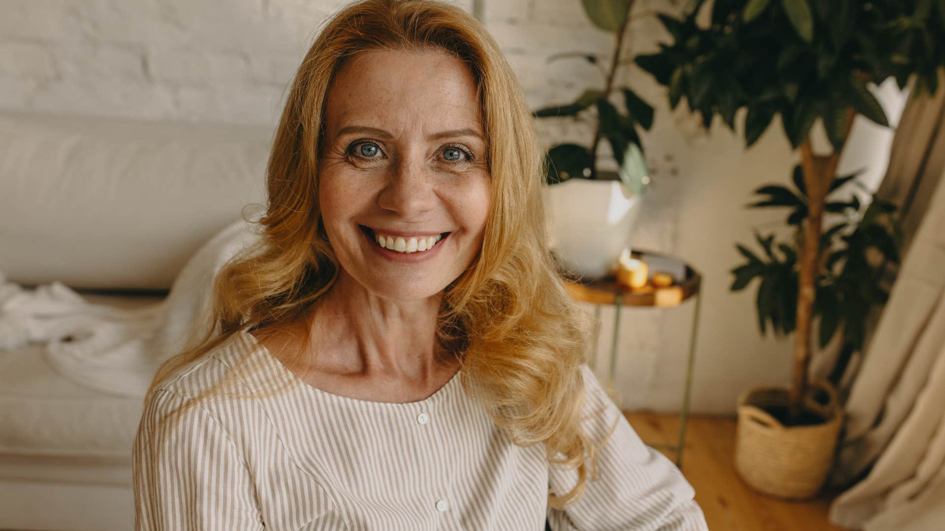 Baby boomer woman with creative thinking skills smiling at the camera.