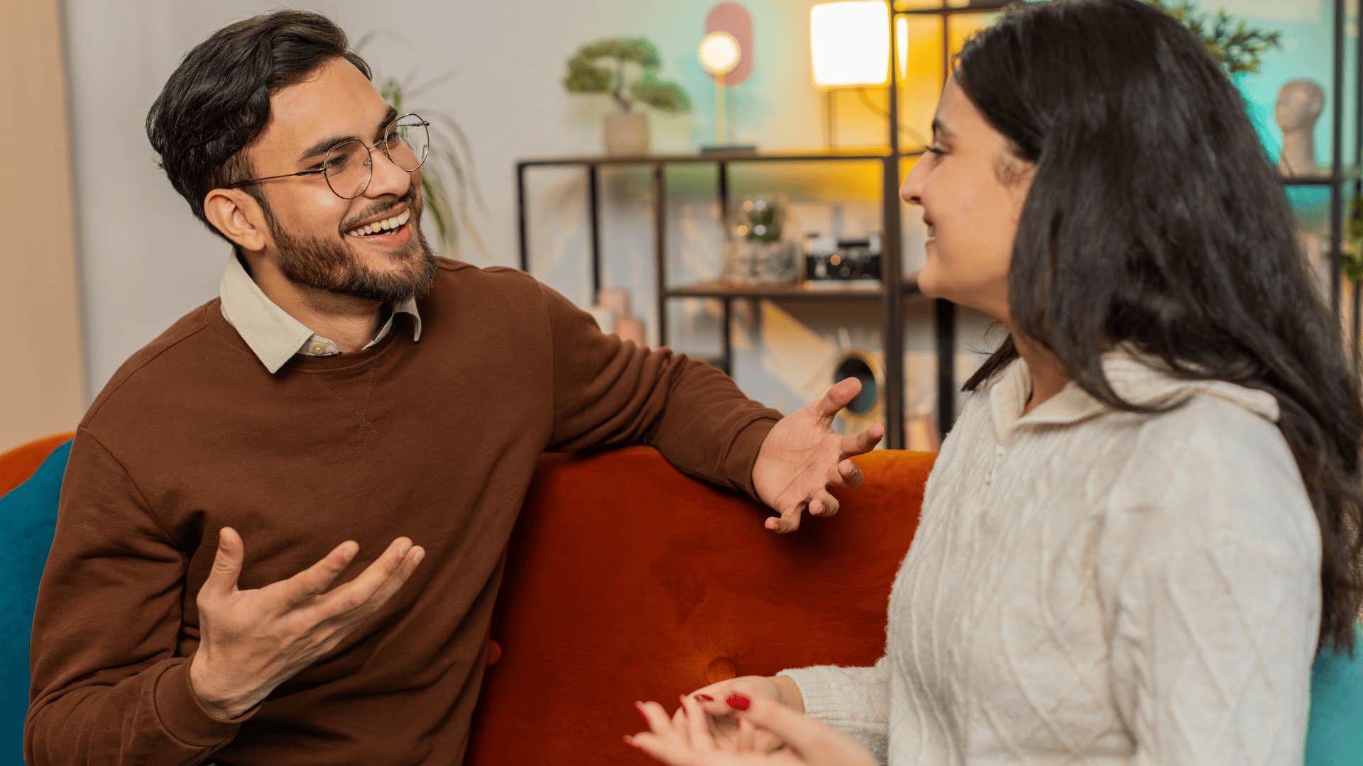 couple talking on couch buidling incredible marriage