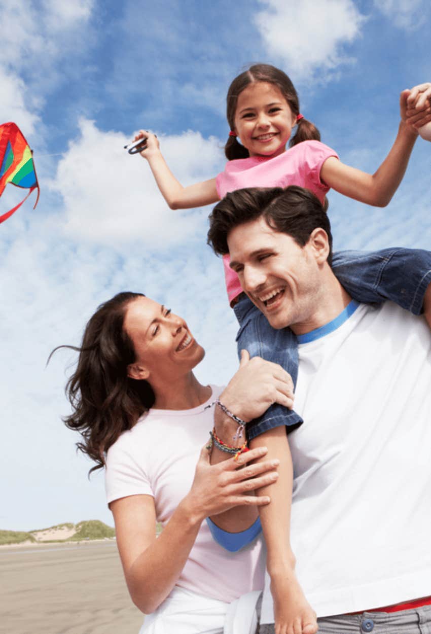 parents having fun with child