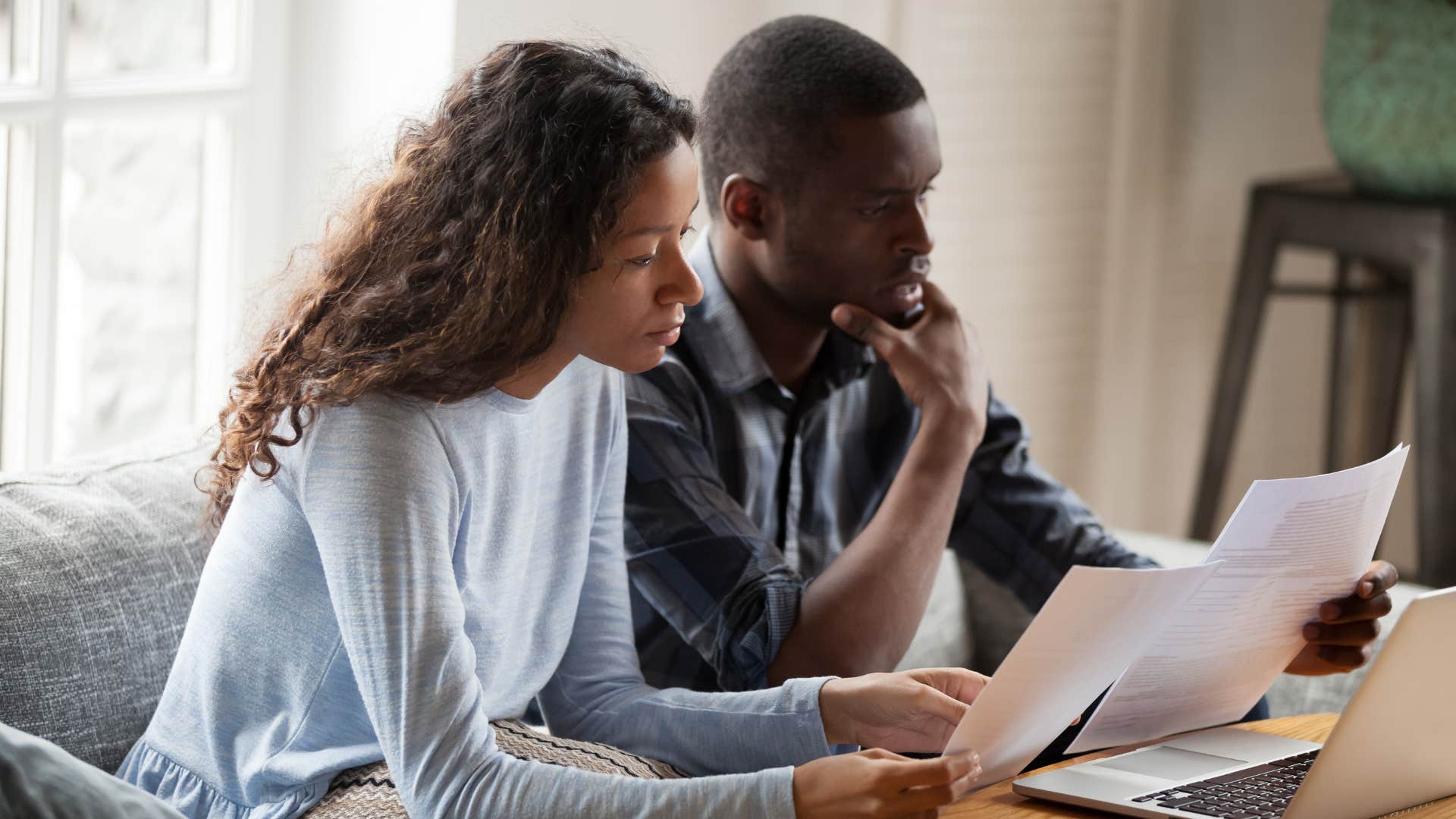 A couple looks over their financial matters together
