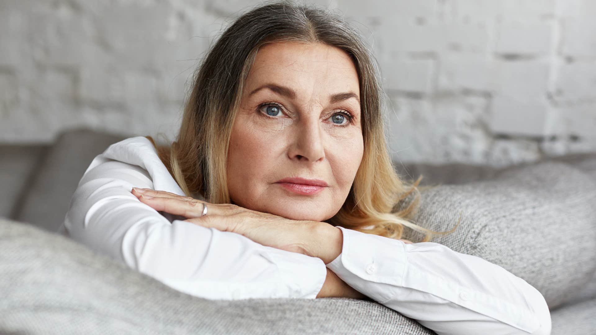 woman done with wasting her time laying on the couch
