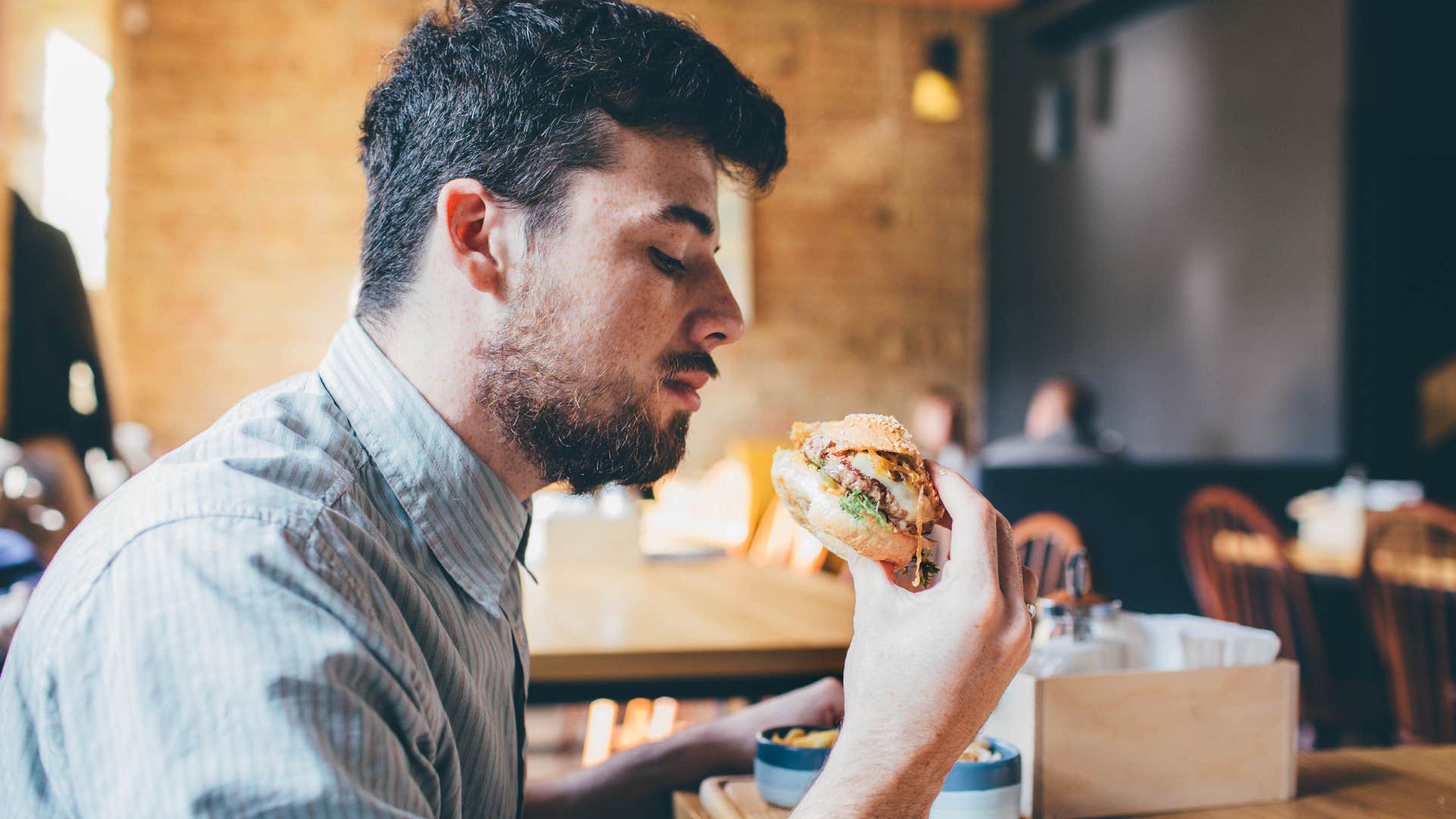 man eating fast food in a restaurant