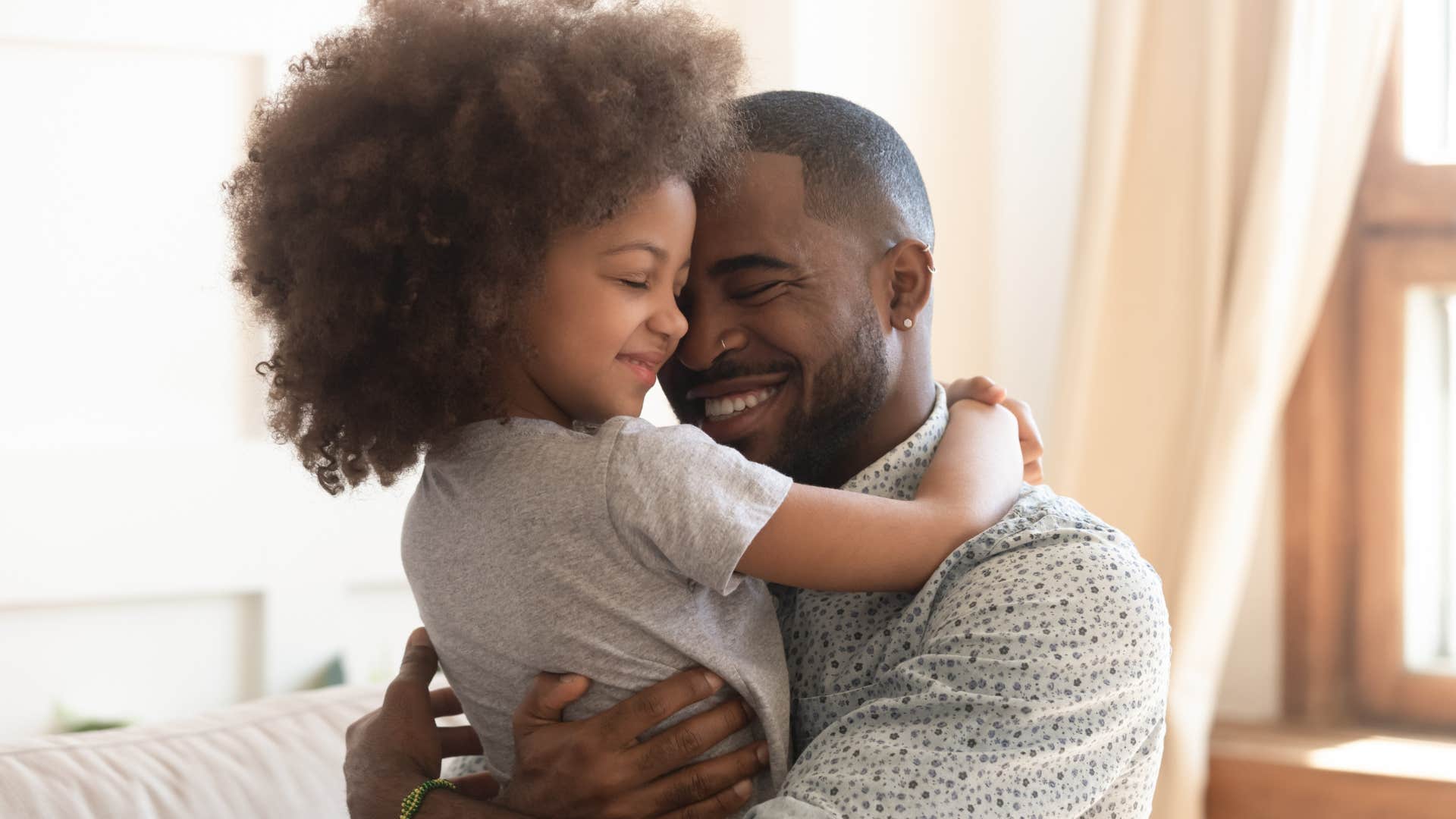 dad being affectionate with daughter