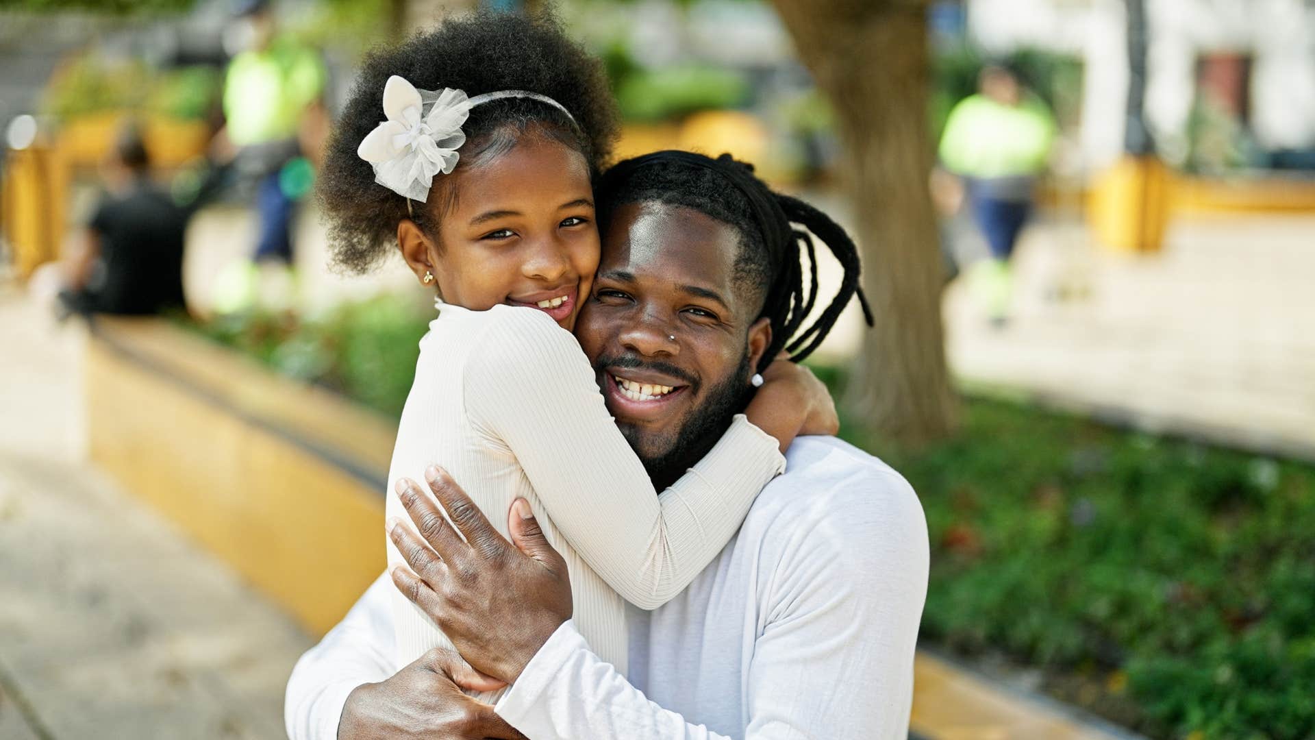 dad hugging daughter instilling confidence in her