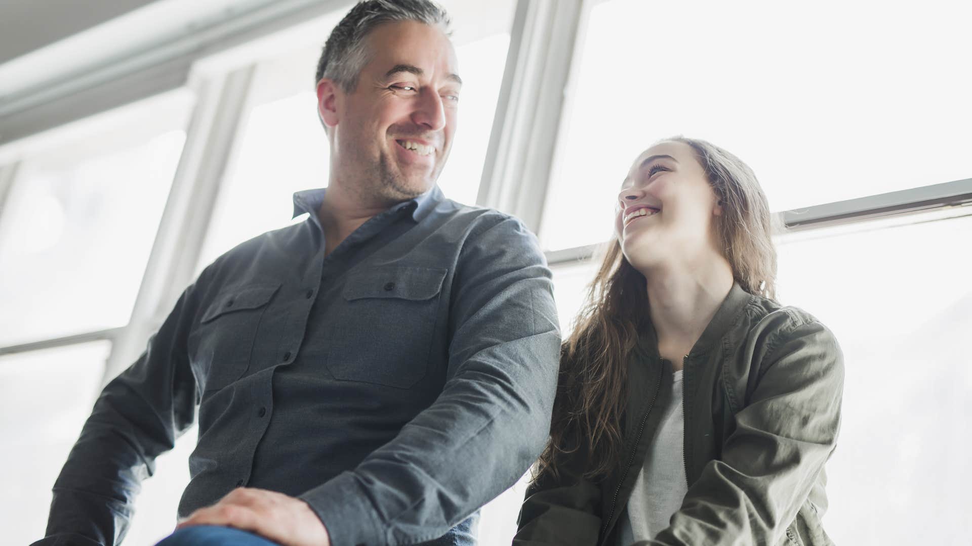 man supporting his daughter encouraging her ambitions