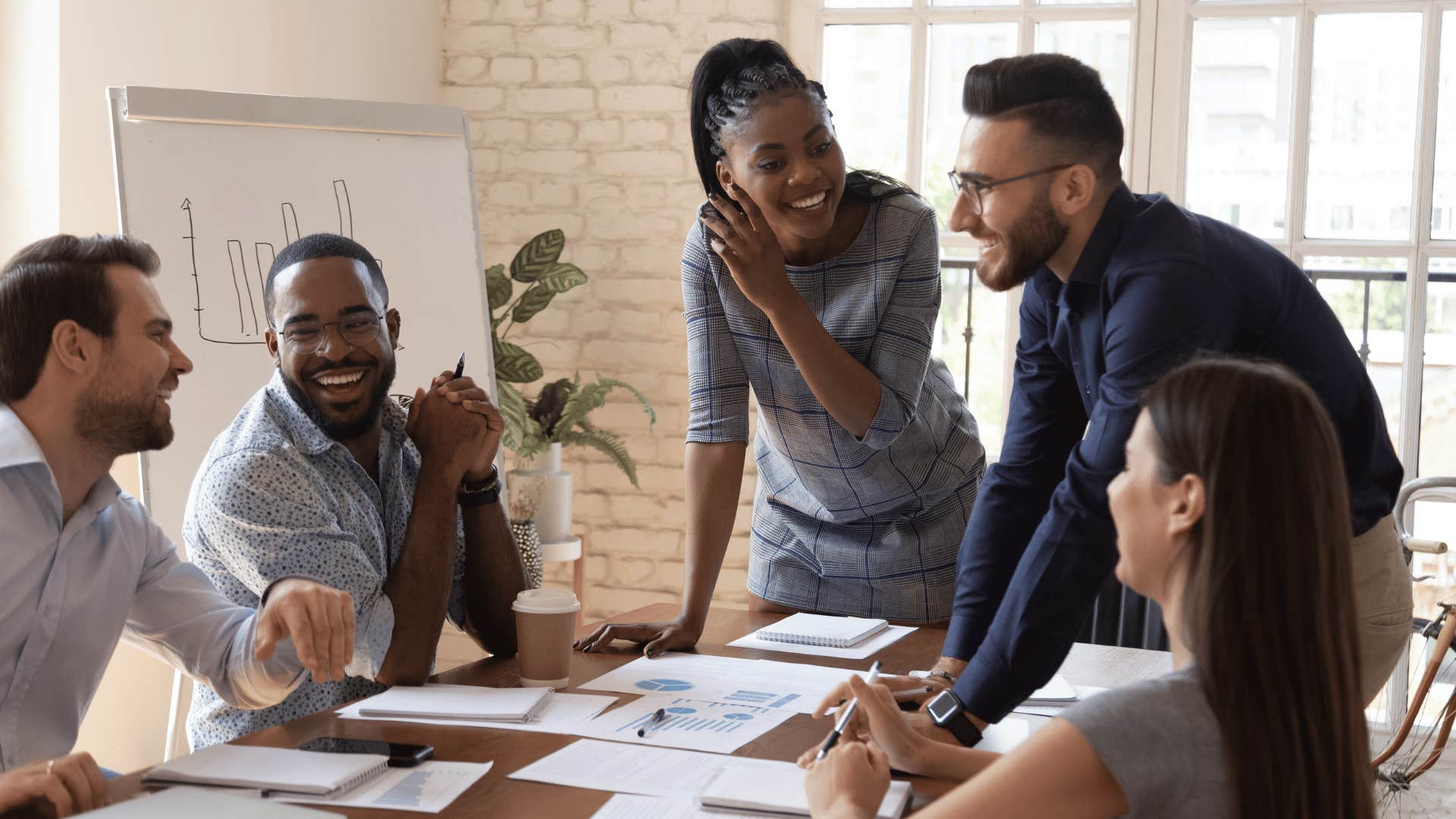 employees at a meeting and discussing project idea