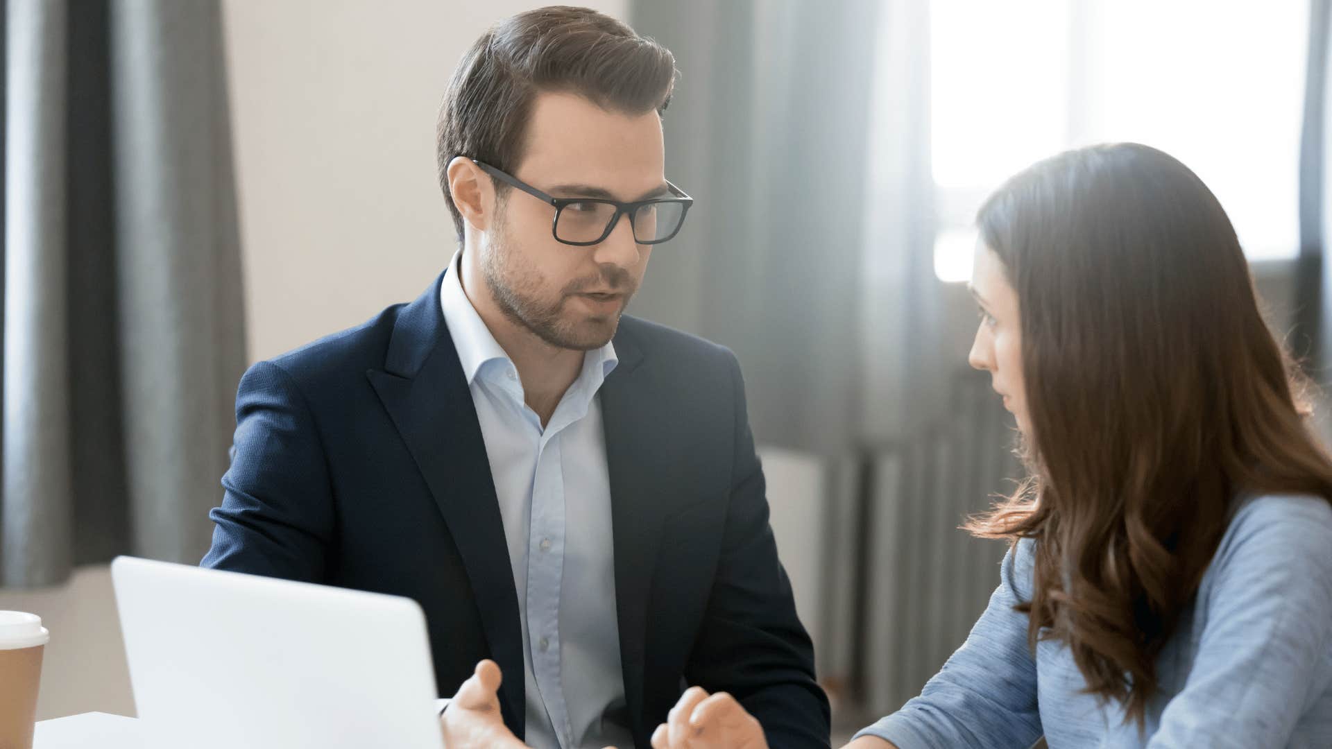 boss explaining to woman the lack of promotion opportunities