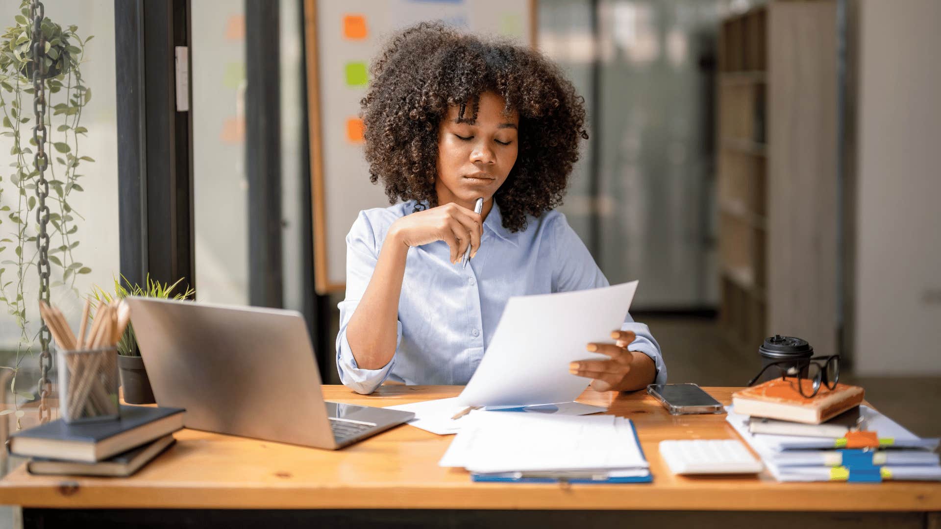 woman with an unreasonable amount of workload meeting expectations and working hard 