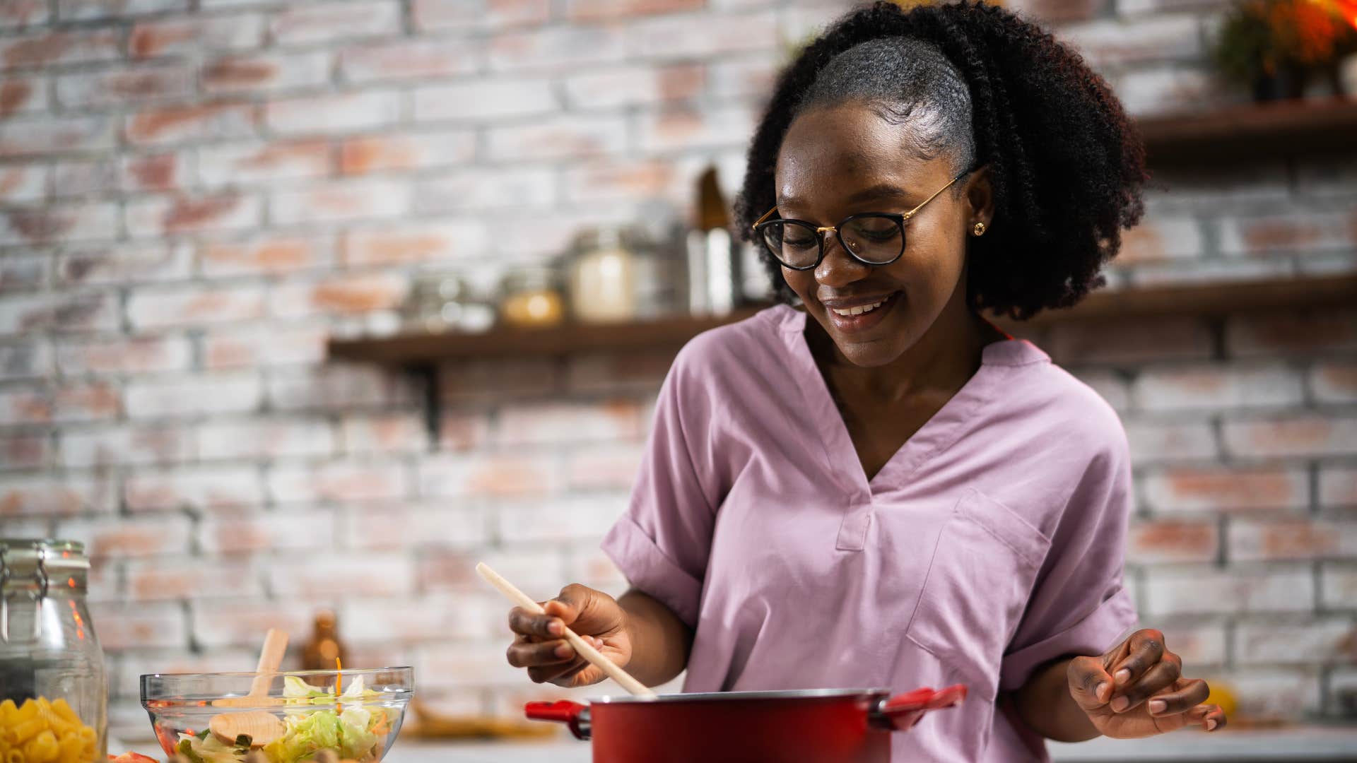 Gen Z woman cooking at home from scratch