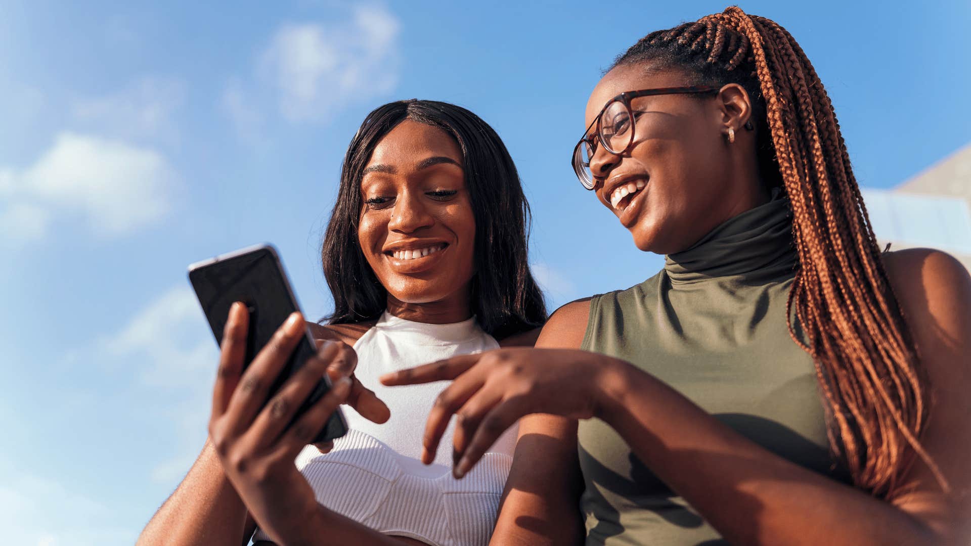 Two happy woman have stopped comparing themselves to others