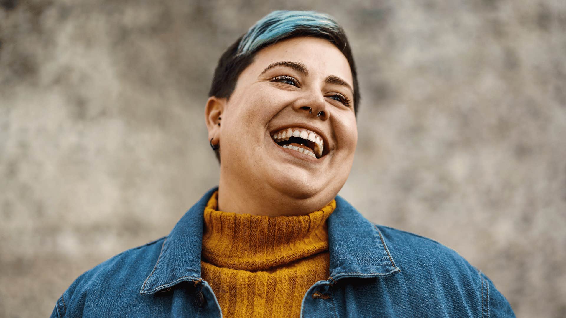 Woman laughing because she stopped caring if men can read her mind