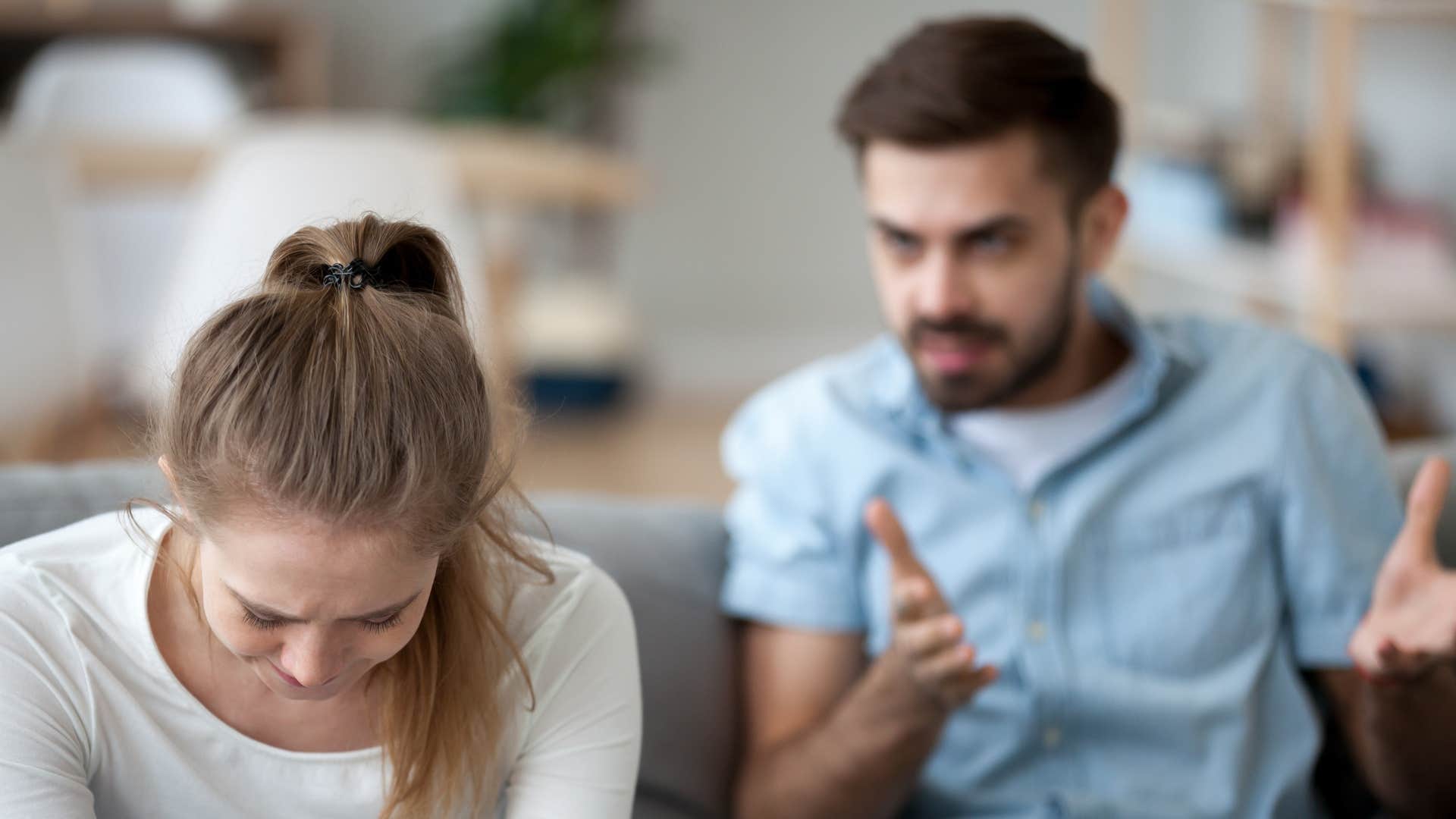 man trying to comfort crying wife who hid her feelings