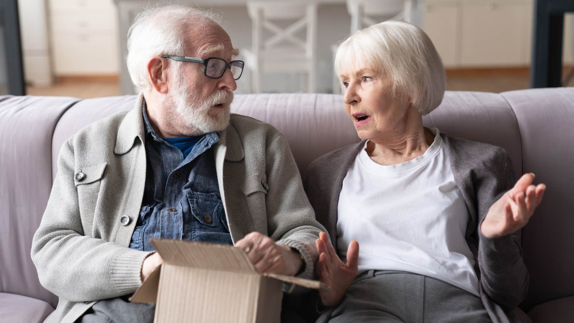 elderly woman explaining to husband she threw away his stuff