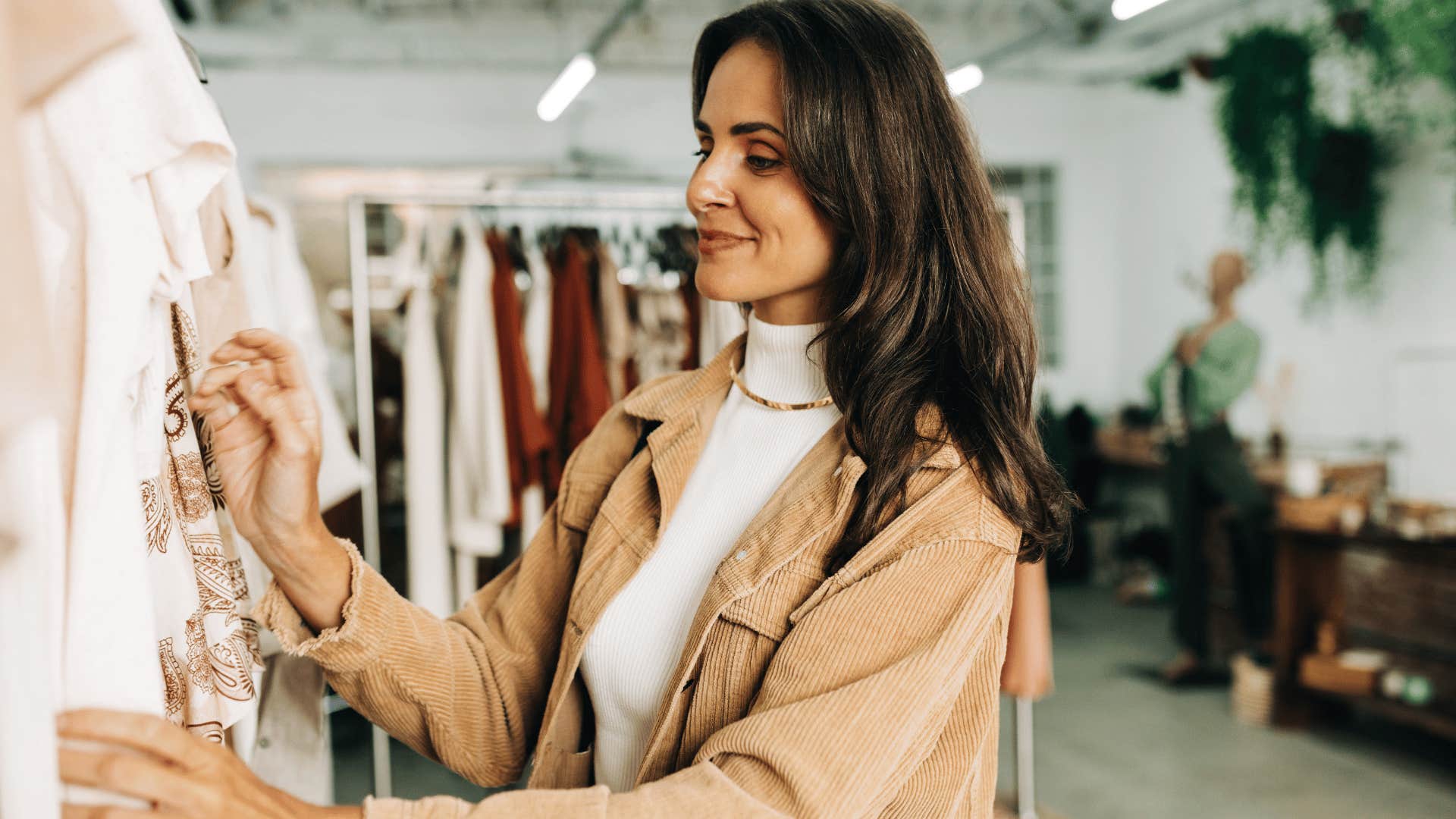 woman shopping for flashy name-brand clothes