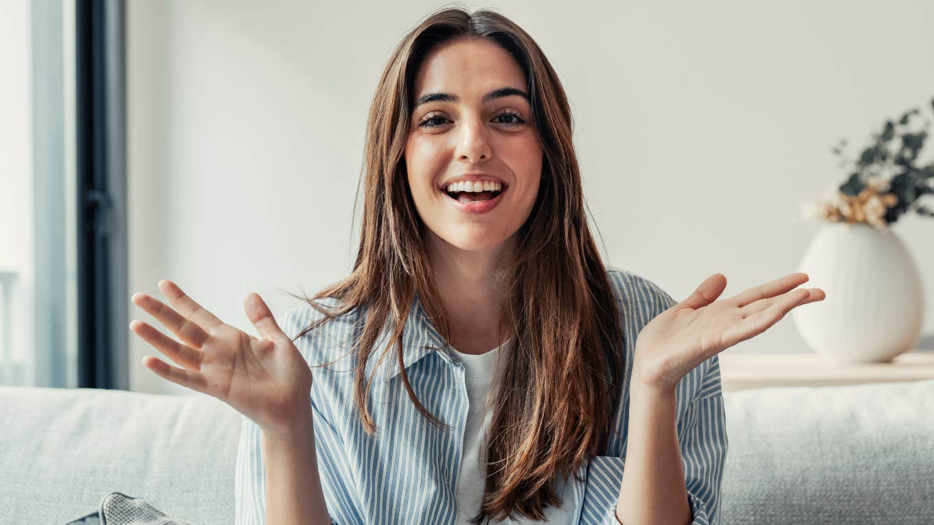 happy smiling millennial woman emoting with her hands