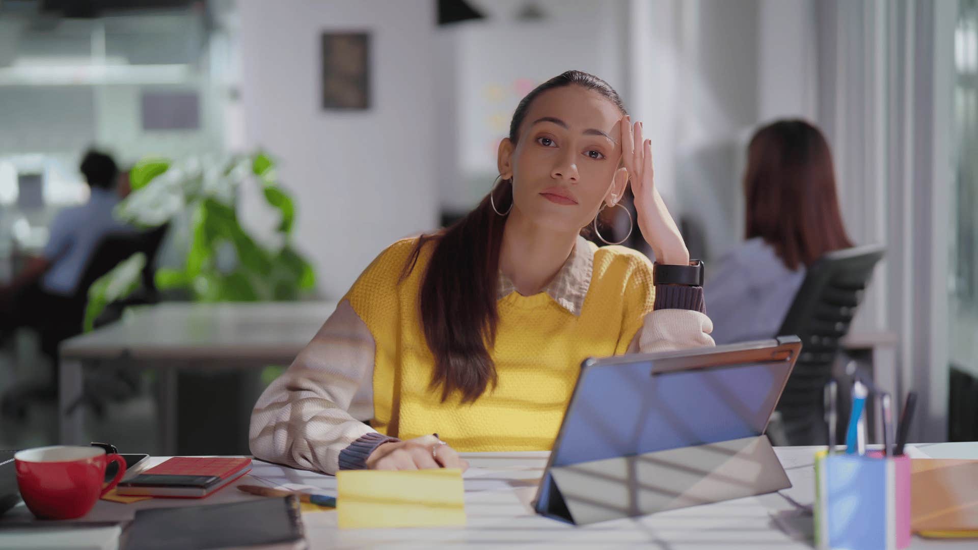 stressed out millennial woman falling behind on work