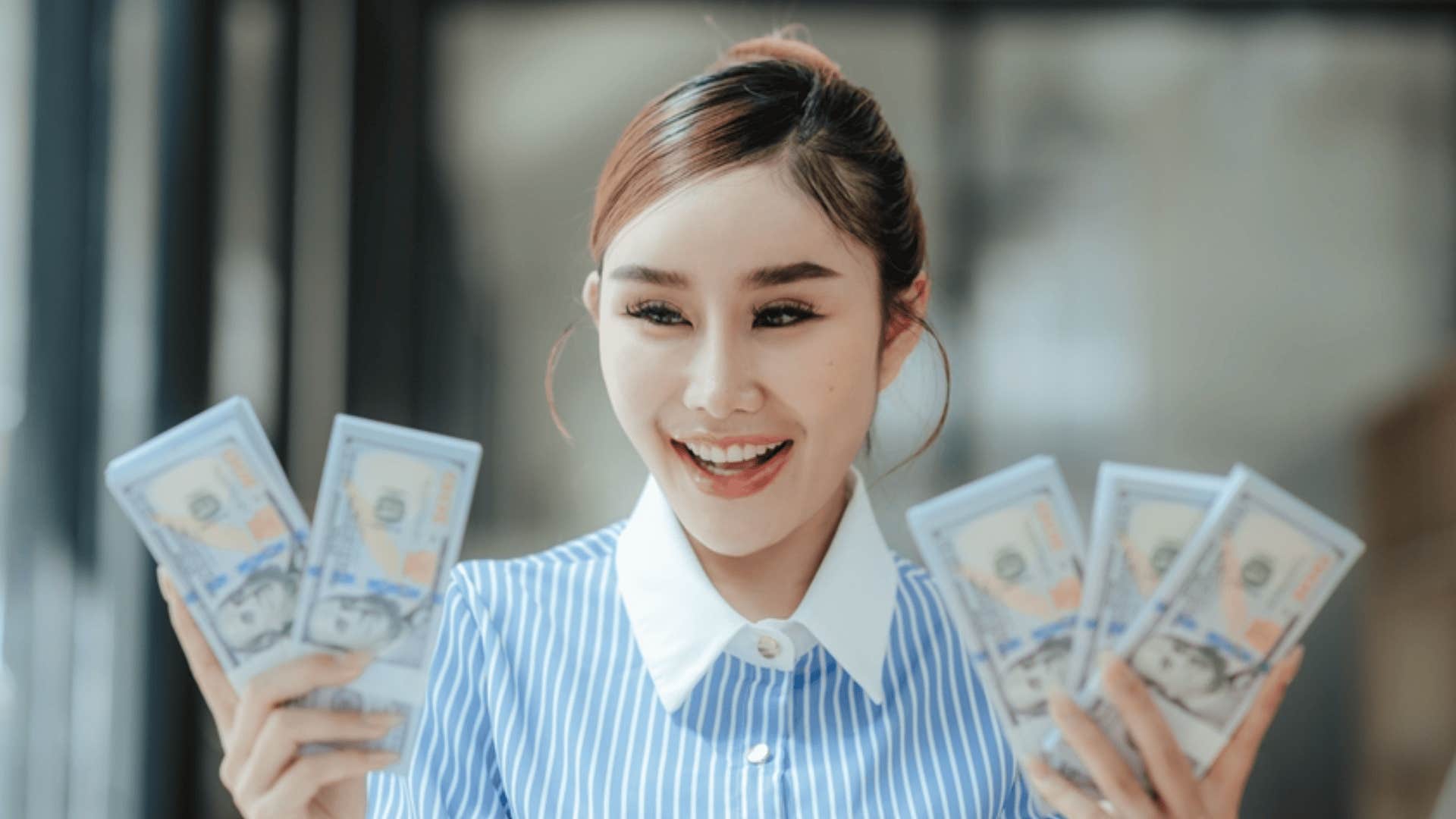 woman showing off wealth