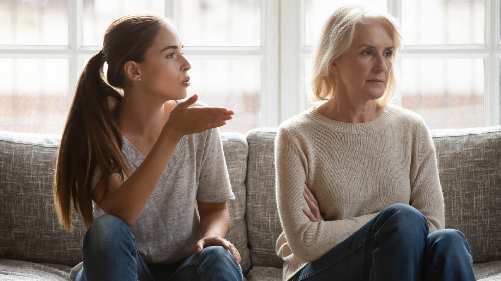 young woman scolding her mother for difference in opinions